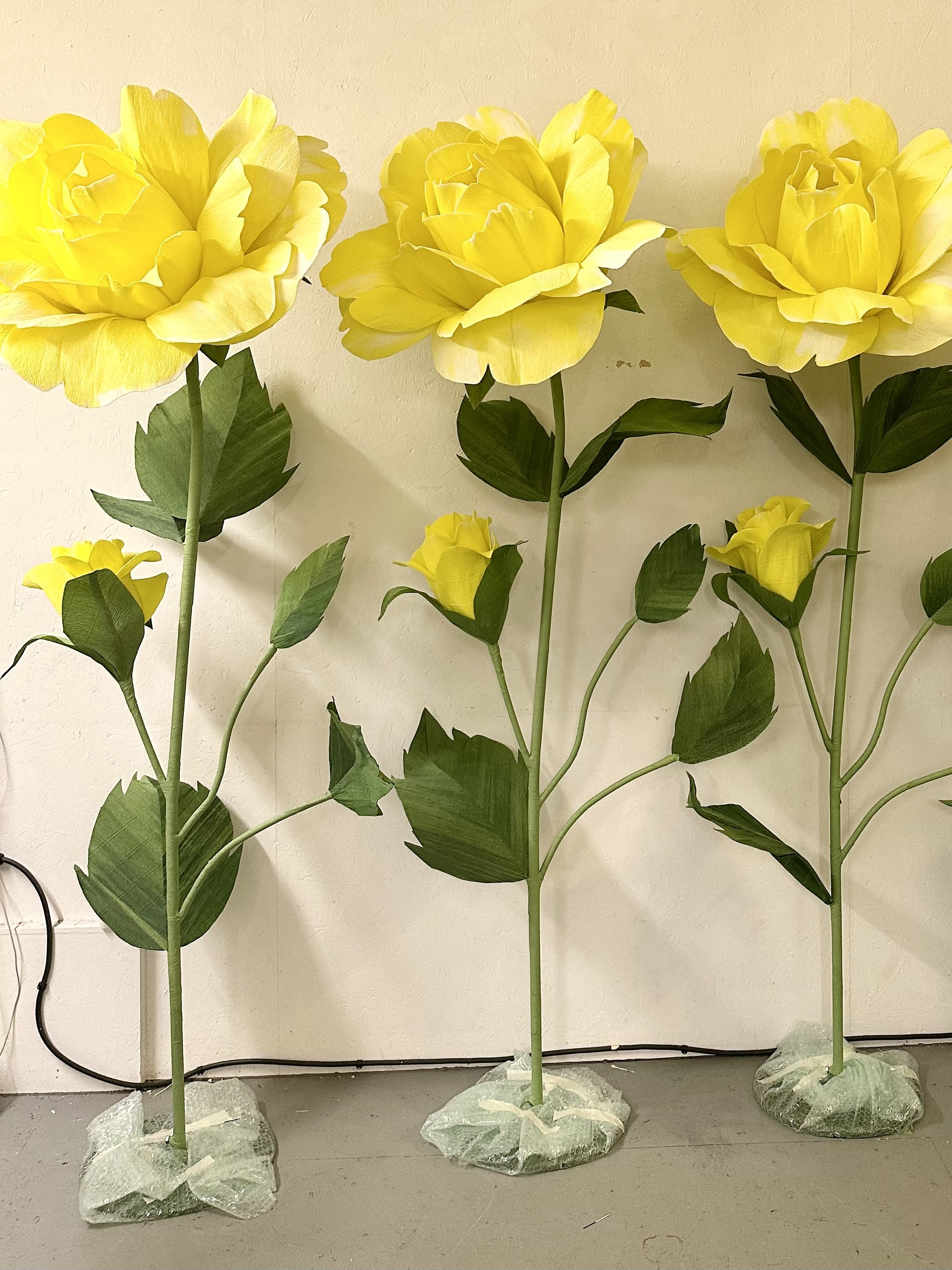 Yellow Paper roses, made in collaboration between Fiona Coupe Studio and Anna Grace Studio for Bichester Village