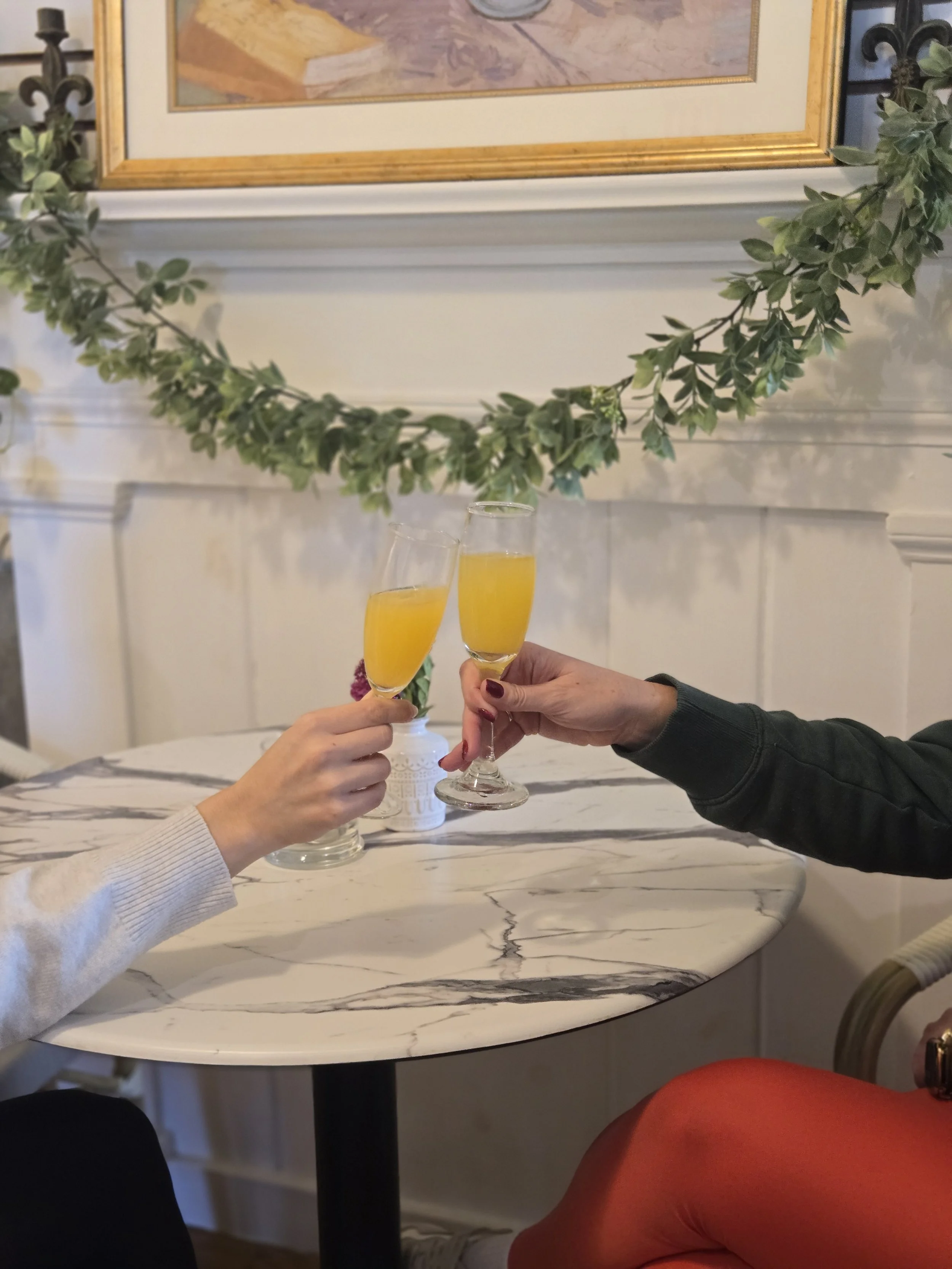women having a mimosa cheers