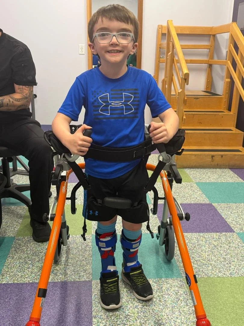 This is Luke! We got him this gait trainer so he can go everywhere safely and independently! 