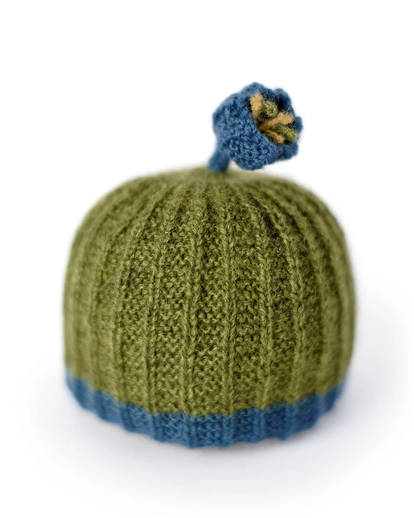Flower Toggle Hat

This sweet little hand knitted child&rsquo;s hat is one of the new patterns just added to my website shop - and it is perfect for the Spring.
Originally published in Designs for Kids, the Flower Toggle Hat is now knitted in the rou