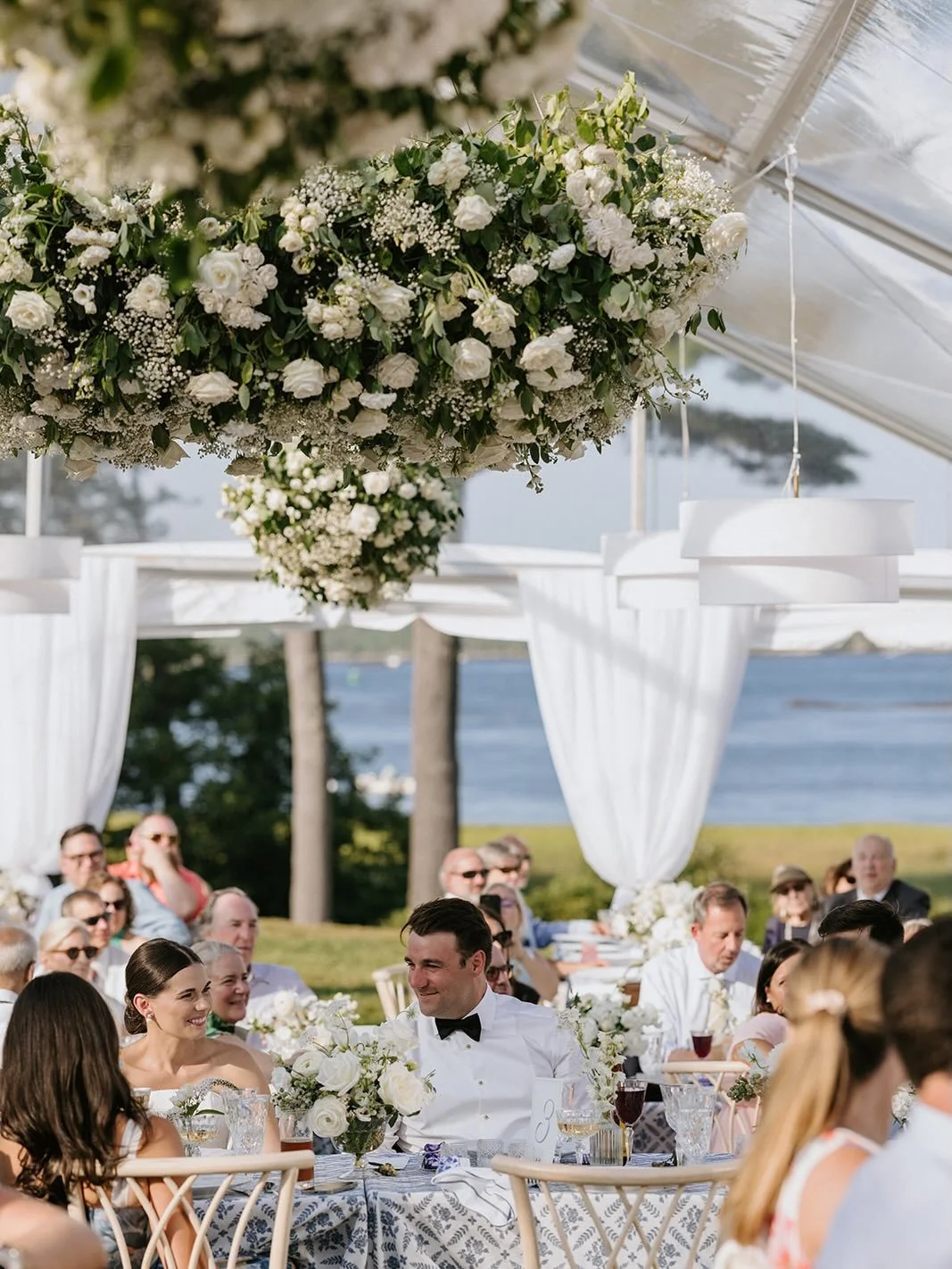 An elevated coastal Maine celebration, complete with fresh blueberry branches, lush white blooms, and dreamy floral clouds floating overhead.

Event Planning &amp; Design: @sheluxewed
Venue: @1774Inn
Photographer: @jillhoylephotography 
Floral Design