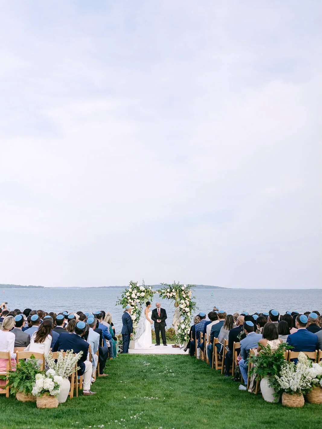 Surrounded by sky and ocean, Steffie and Nik exchanged vows on Peaks Island, beneath a birch chuppah adorned with flowers.

 
Photography: @rachelbuckleyweddings 
Planning: @landfalldesigns 
Catering: @frenchpicniccatering 
Lighting: @griffingriffinl
