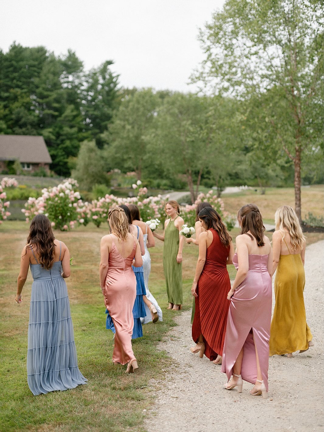 Proof that a bridal party can wear every color &mdash; and still feel effortlessly cohesive.
Jewel tones moving like silk through blushing September hydrangeas.

And the best part? Ali&rsquo;s bridal bouquet pulled every shade together, unifying this