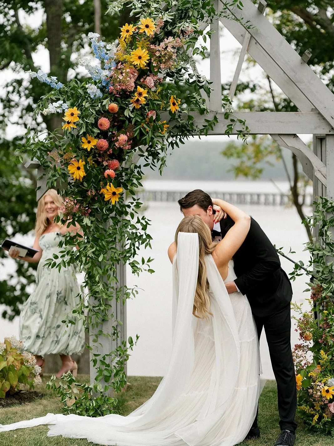 Our installation pieces are designed on site &mdash; custom to the setting and structure. Designing this way allows for natural movement, and for flowers to feel as though they&rsquo;ve grown exactly where they belong.

For this waterfront arbor, gol