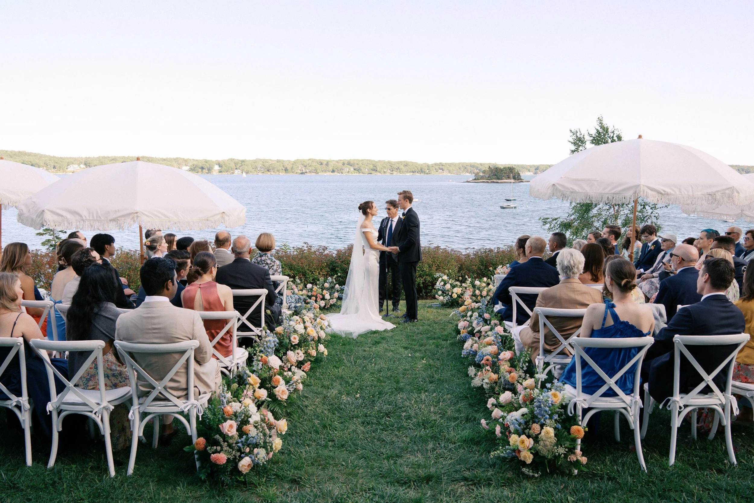 aisle flowers, grounded flowers, colorful wedding ceremony, oceanfront wedding ceremony