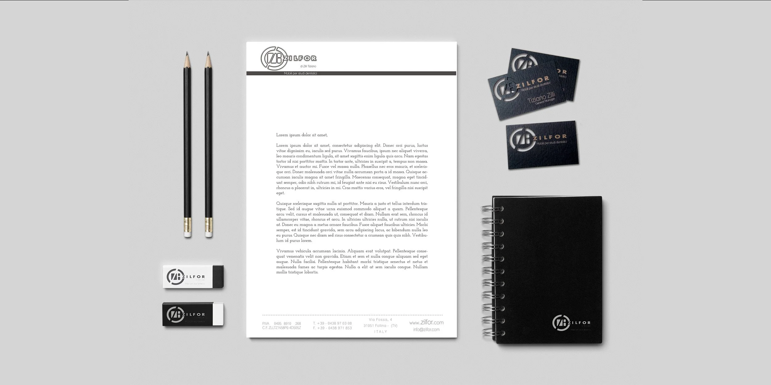 Zilfor brand identity system showing coordinated stationery, business cards, notebooks, and professional communication materials.