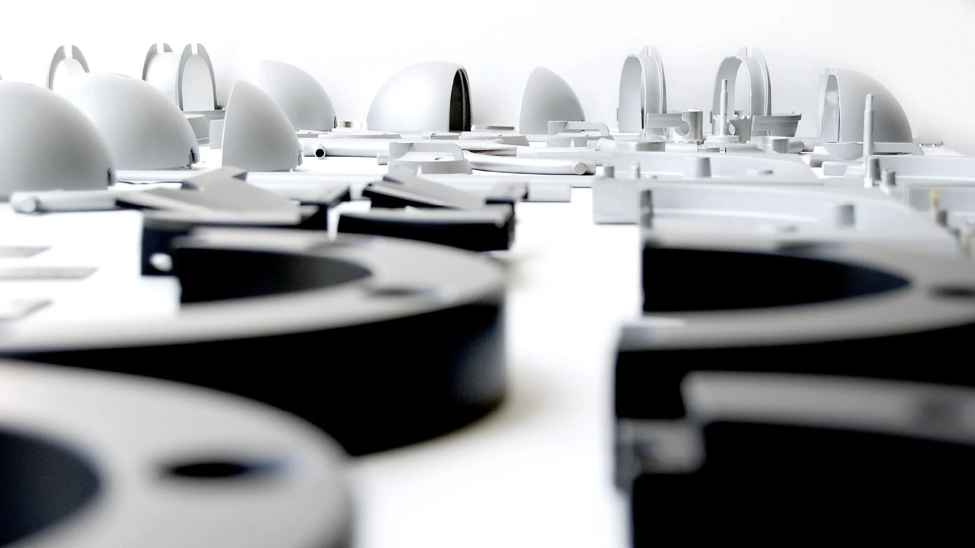 Tutondo product and spatial design models exploring modular forms, circular geometries, and system thinking for audio and interior applications.