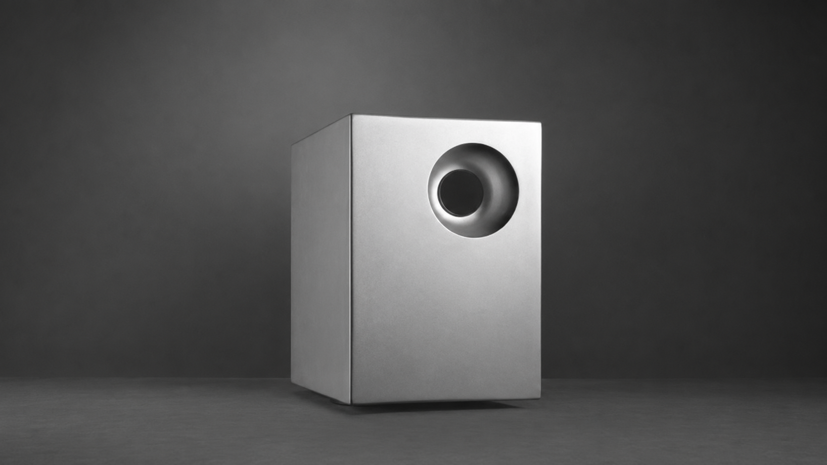 Tutondo subwoofer speaker design showing a minimalist audio product with a circular driver, developed for contemporary home sound systems.