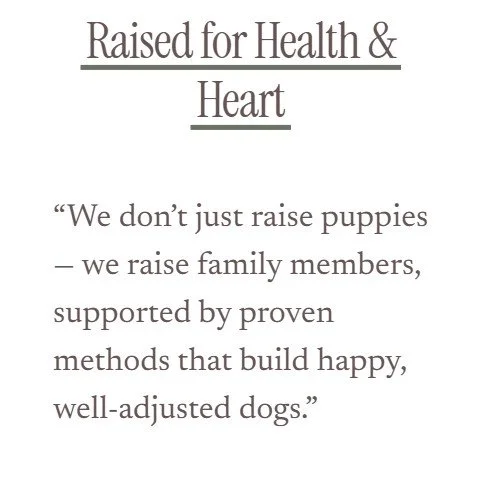 Text on a sign that reads: "Raised for Health & Heart. We don't just raise puppies - we raise family members, supported by proven methods that build happy, well-adjusted dogs."