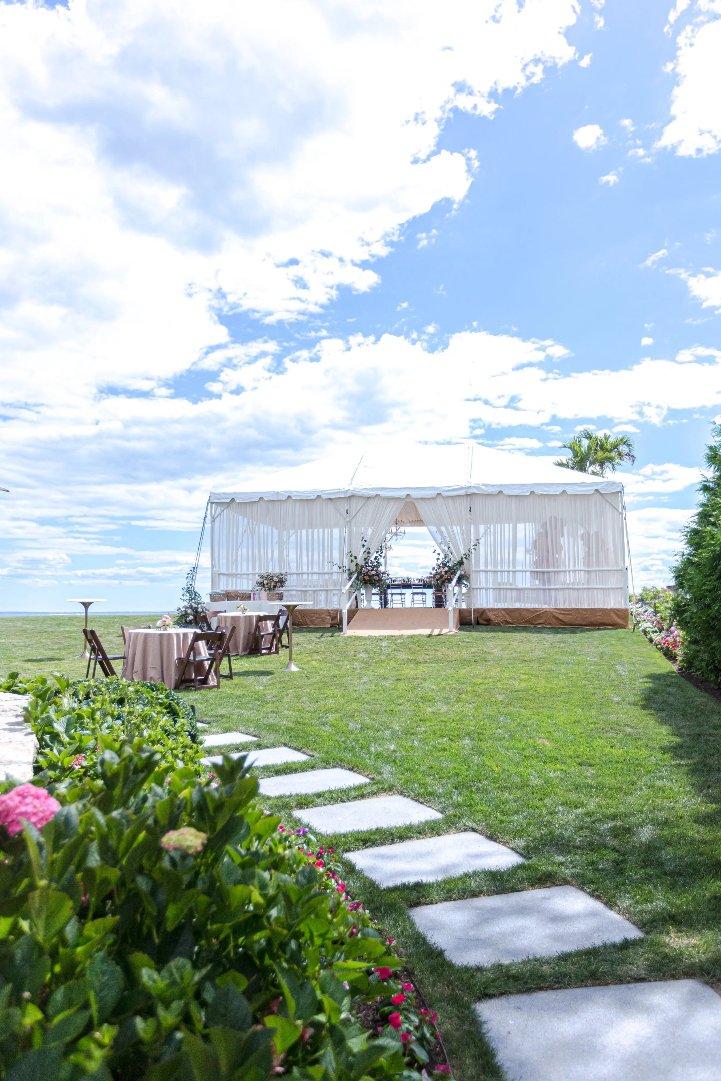 Ivory-draped tent set for a baby shower at a private Connecticut residence