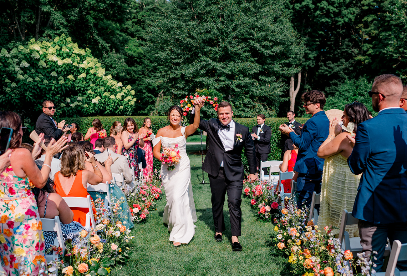 Couple portrait during a Smith Farm Gardens wedding surrounded by lush garden landscapes