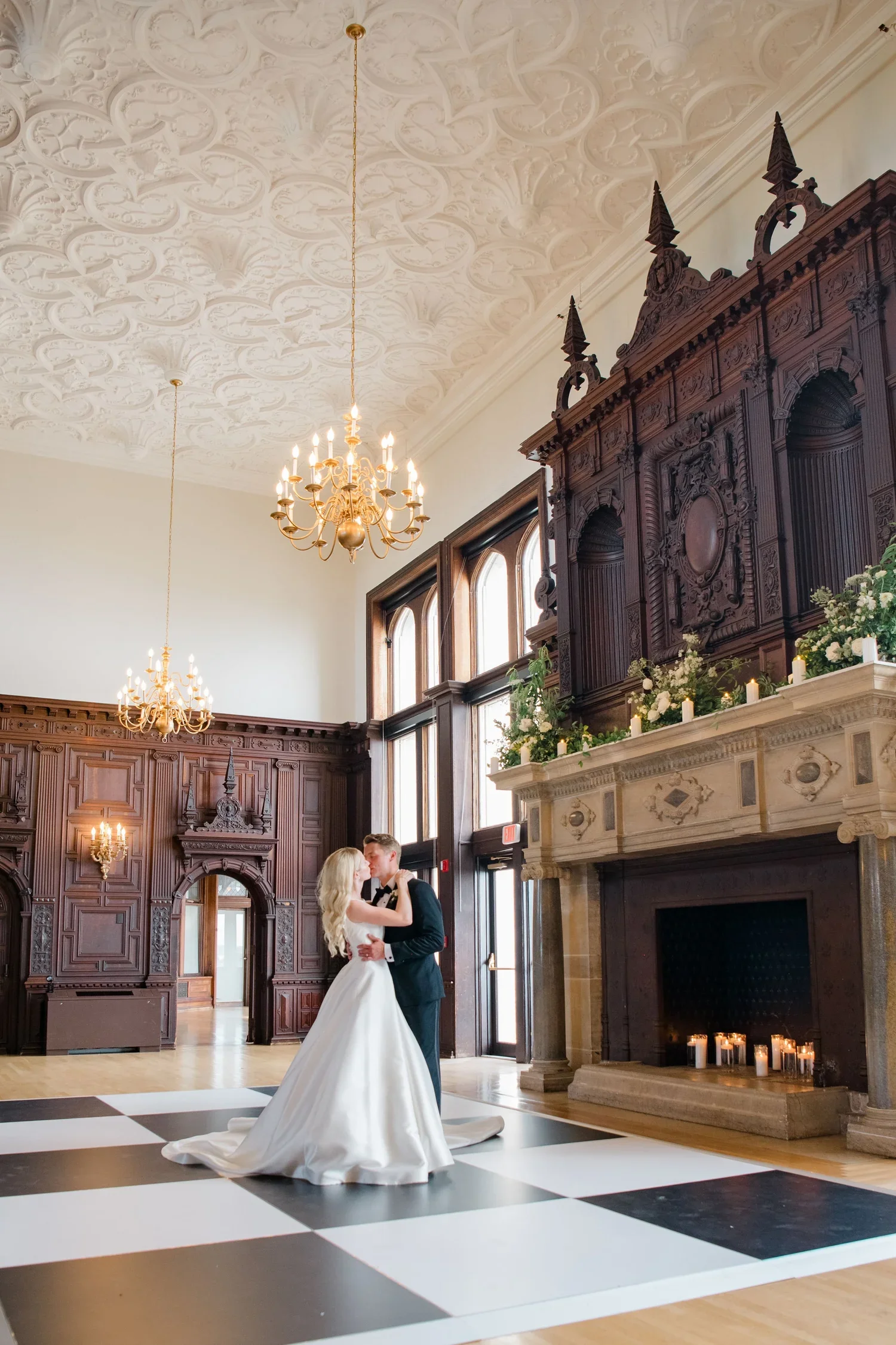 Branford House ballroom wedding reception with grand fireplace mantle and candlelight