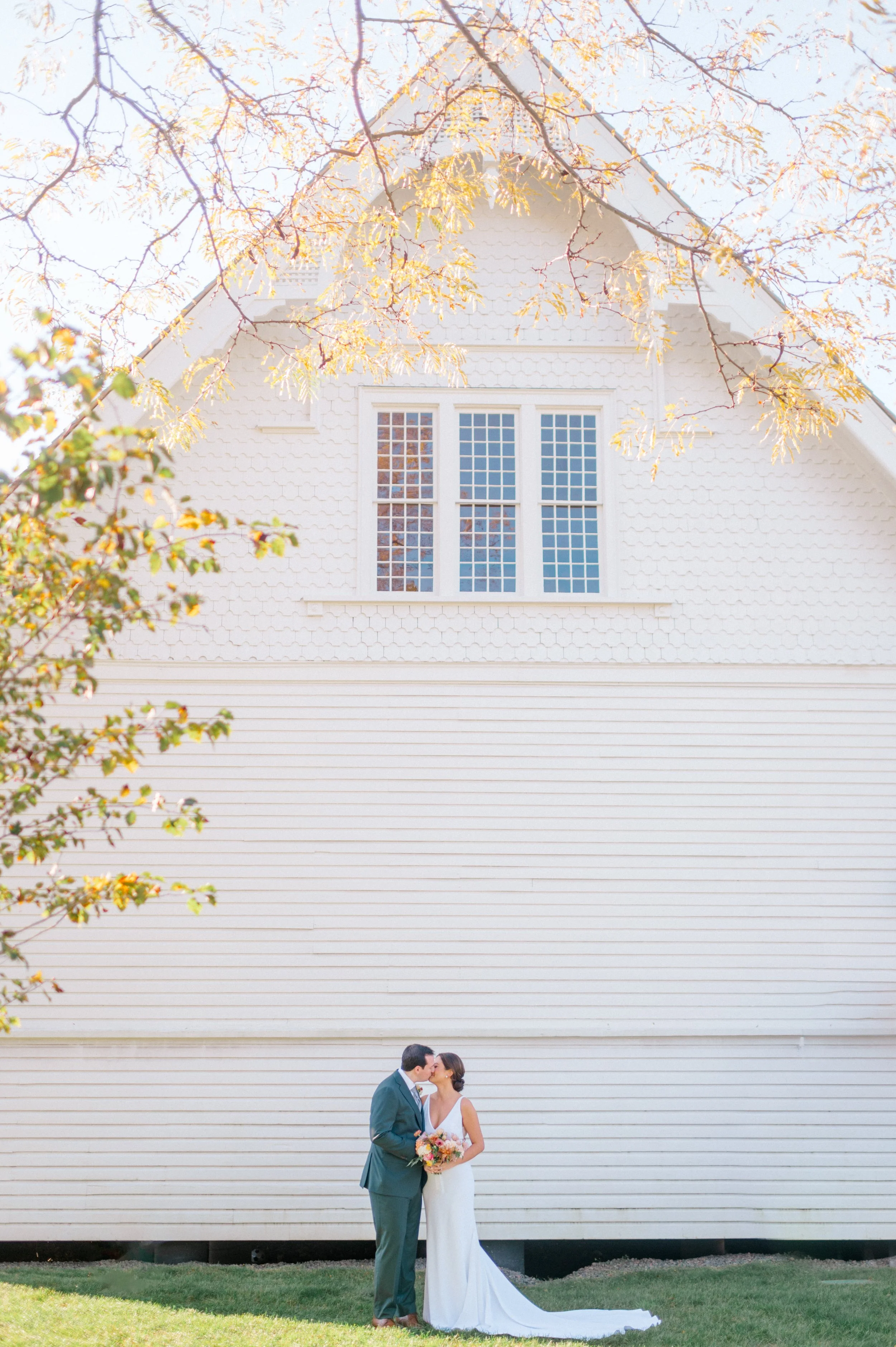 “Meadowcore-inspired ceremony florals dancing gently in coastal breeze.”