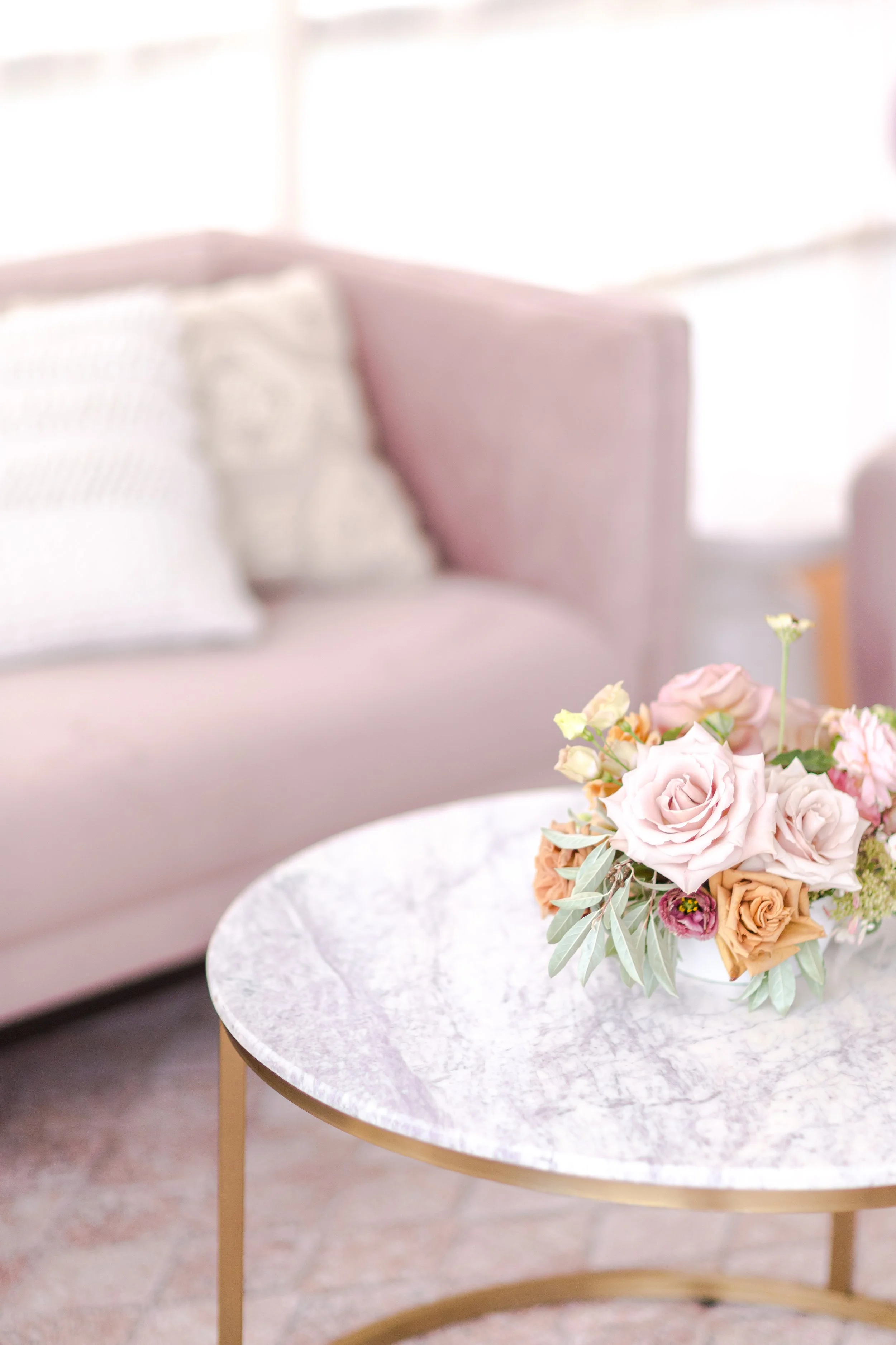Low floral bowl centerpiece at a luxury baby shower