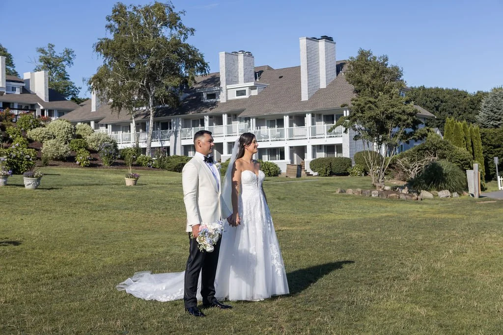Couple portraits overlooking Long Island Sound at Water's Edge Resort and Spa Connecticut on their wedding day