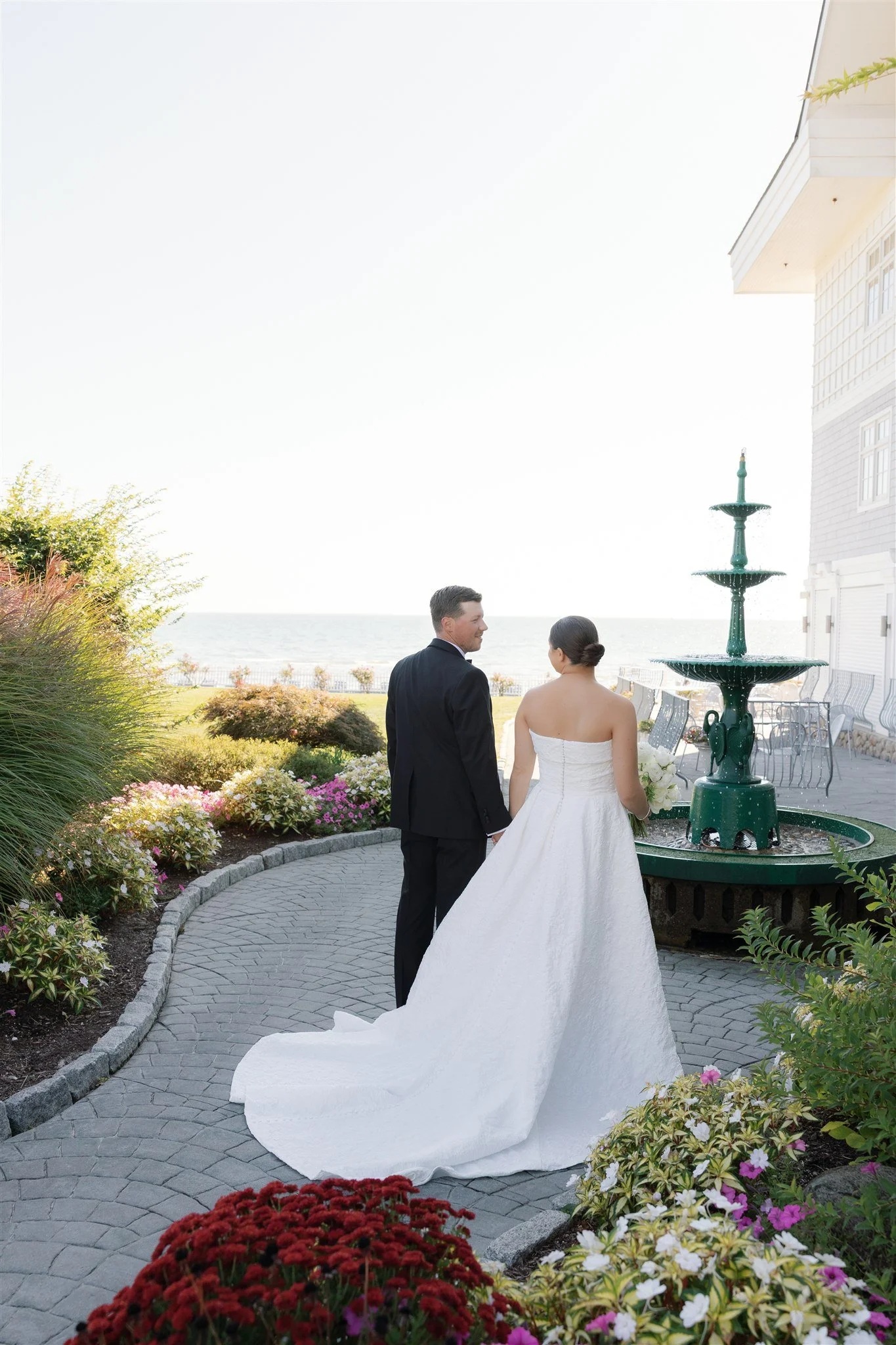 Clean, tailored bridal styling against the coastal breeze.