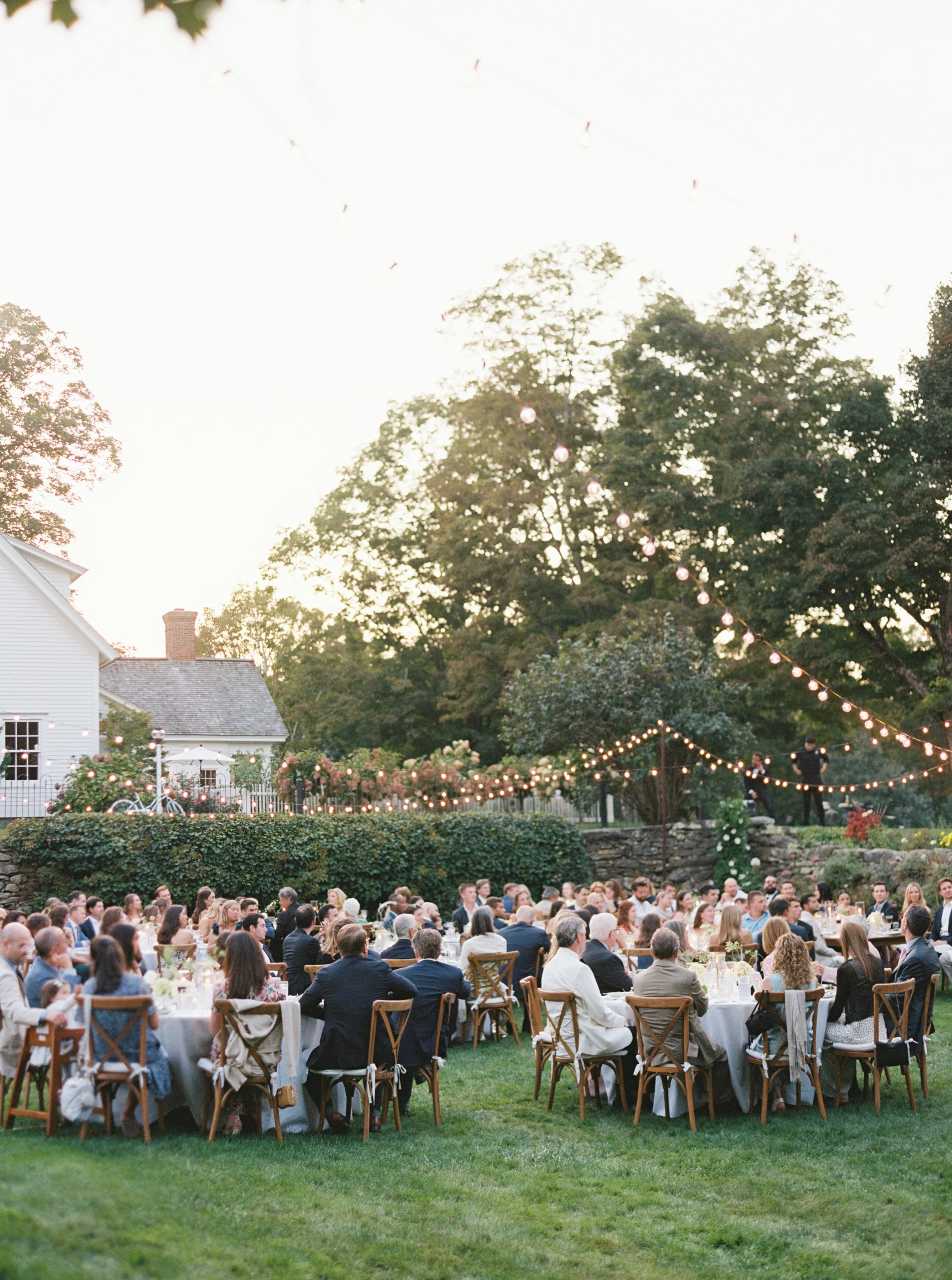 Reception in the sunken garden under strands of lights.