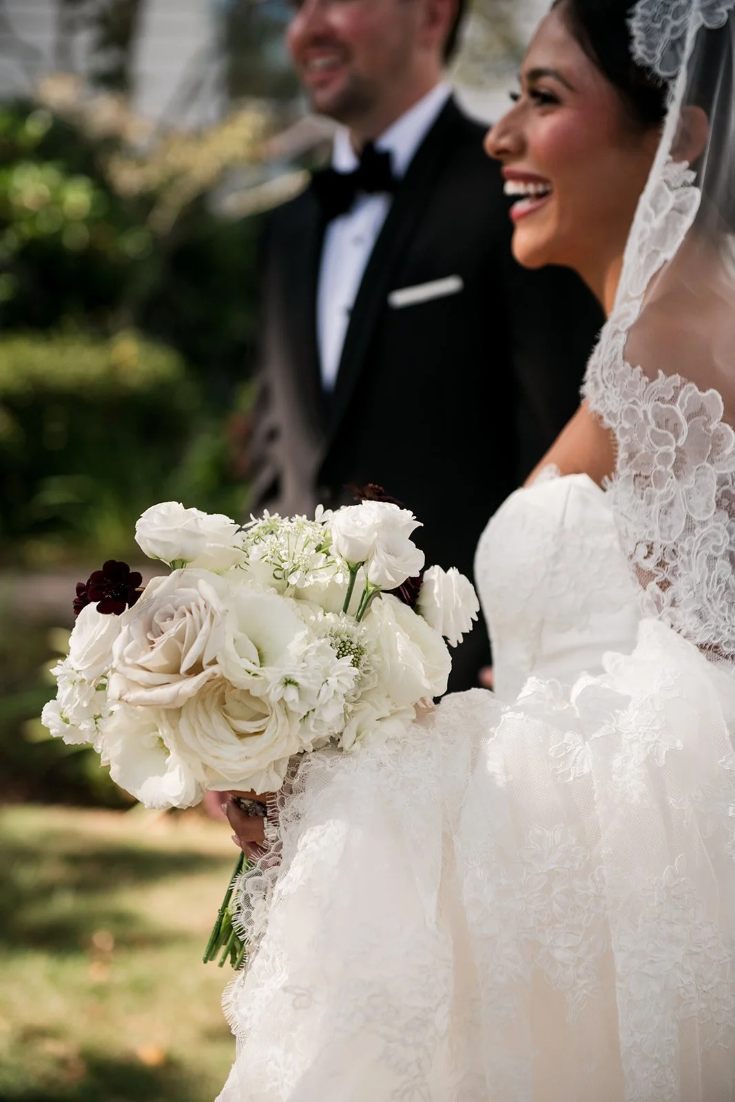 Editorial wedding couple portrait captured among historic architecture and coastal light.