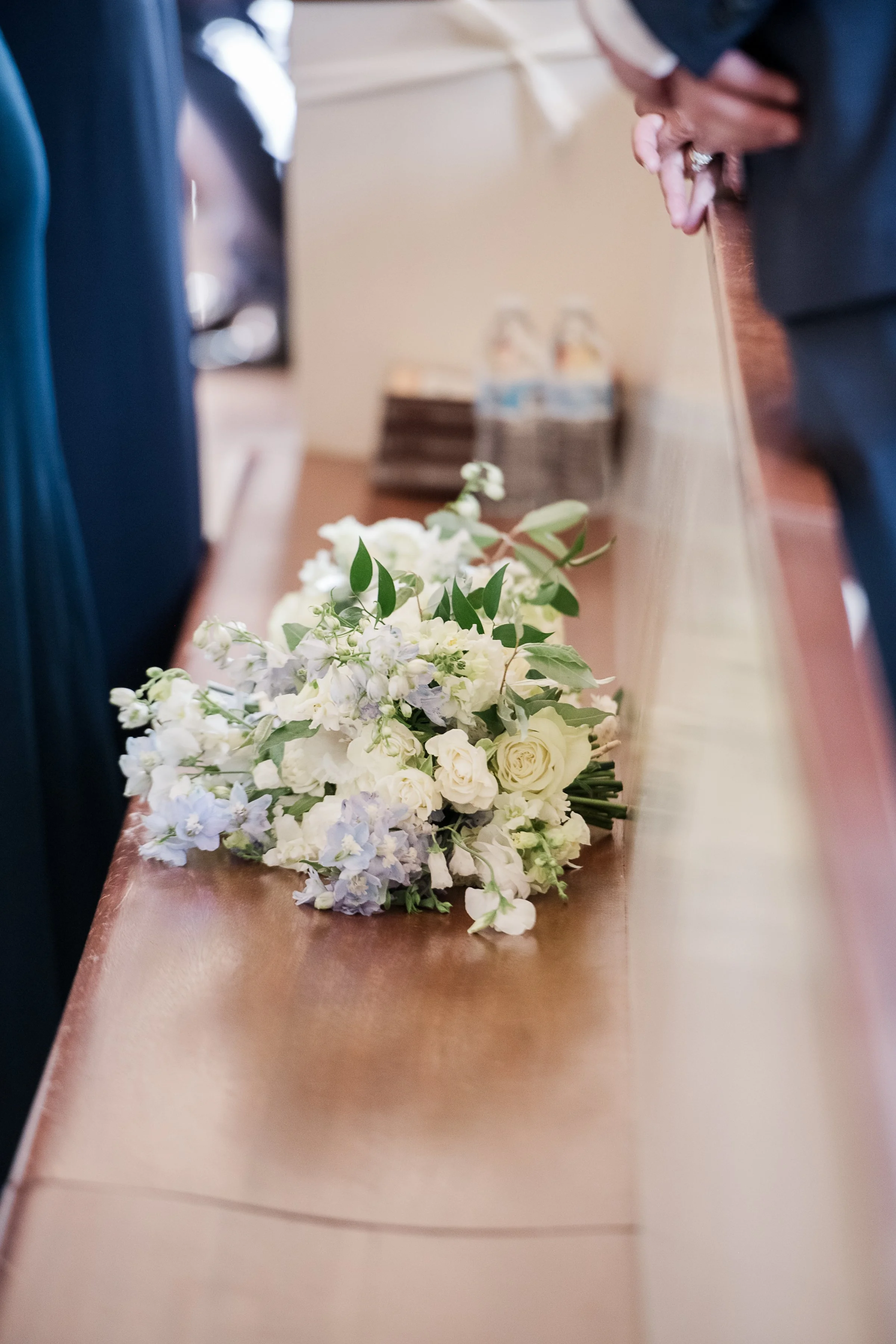 Elegant white and blue altar flowers for St. Paul’s Waterford church wedding ceremony
