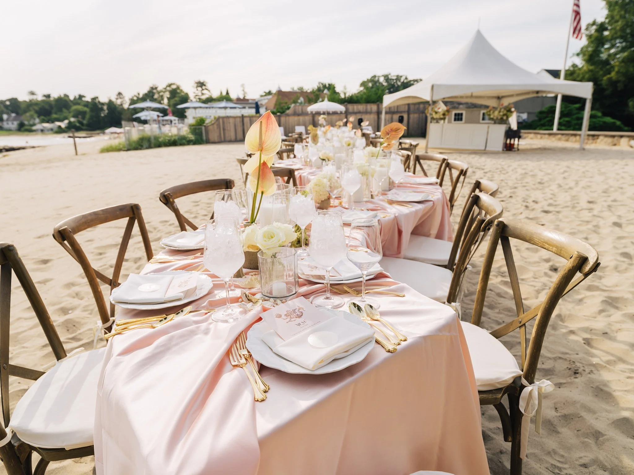 Terracotta bud vase with iridescent anthurium and garden roses on blush satin linen, coastal Connecticut bridal shower tablescape by First Blush Floral Design + Planning