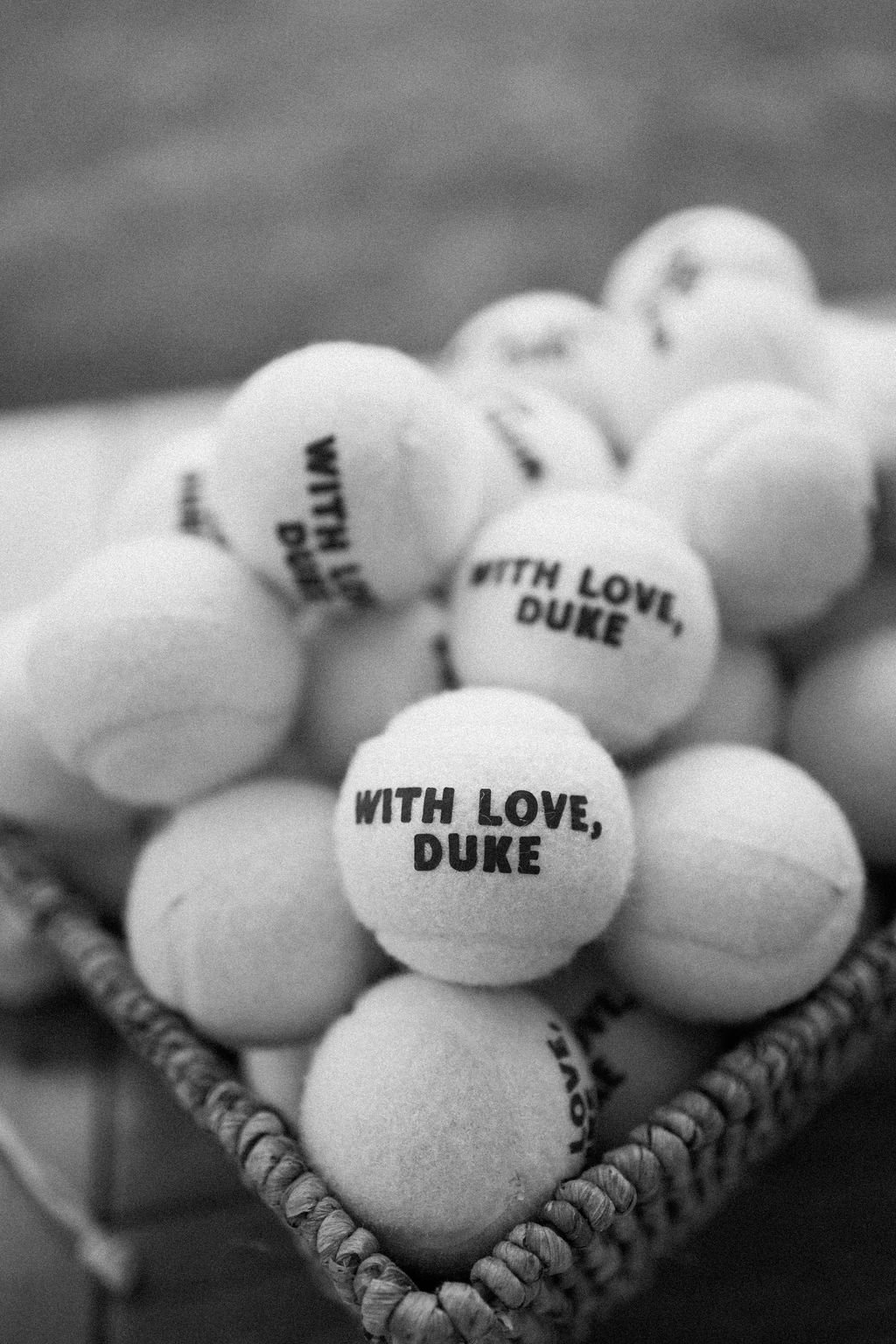 Black and white photograph of personalized wedding keepsake balls arranged together.