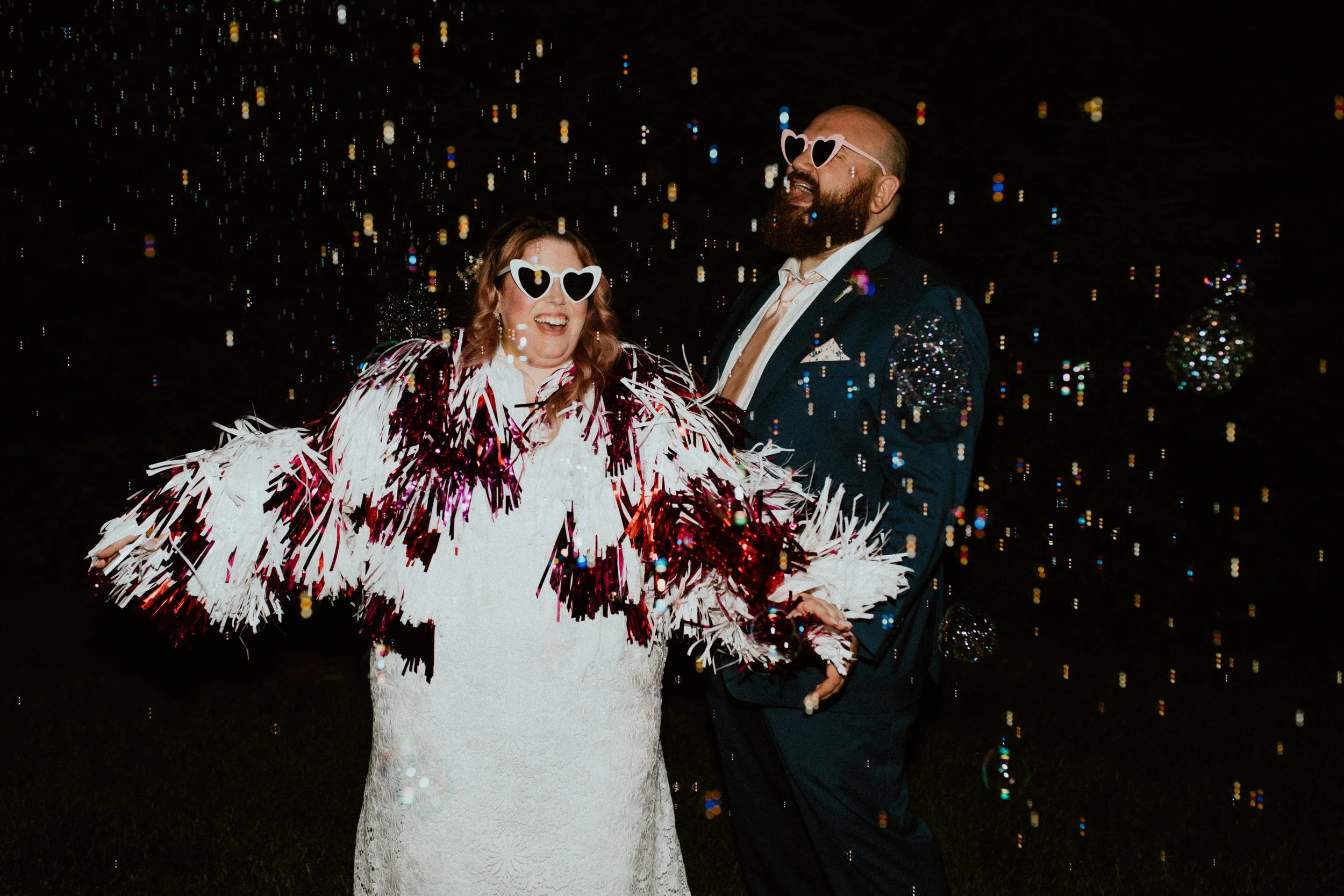High-energy wedding couple celebrating a colorful, modern wedding day.