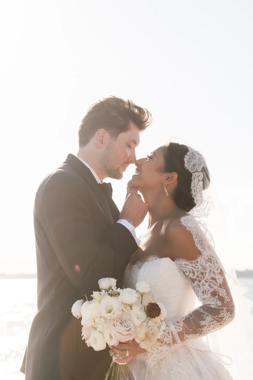 Luxury wedding bouquet designed by a Connecticut wedding florist in an all-white palette.