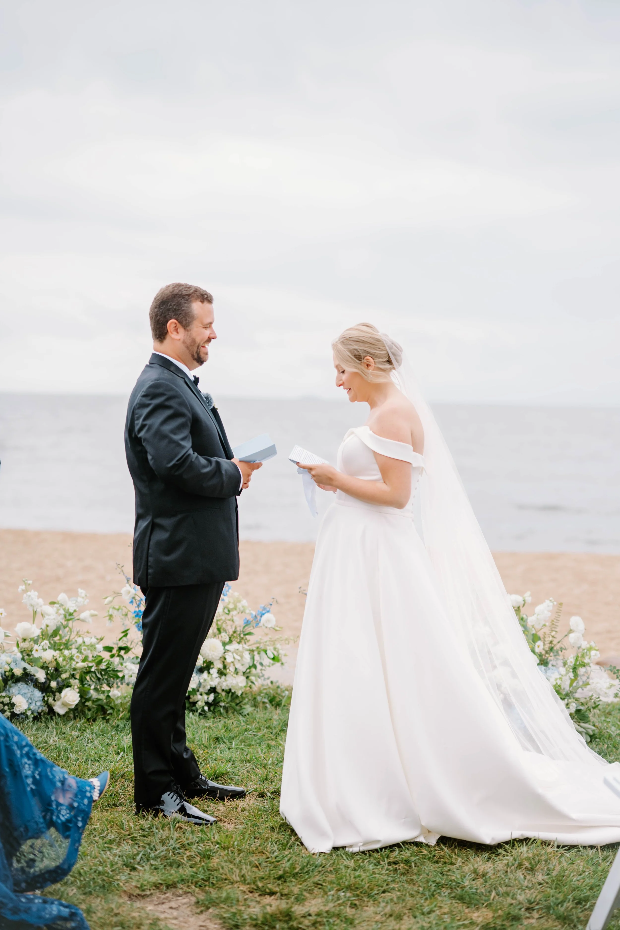 Sunset portraits on the beach outside Madison Beach Hotel with soft blue sky and gentle waves.