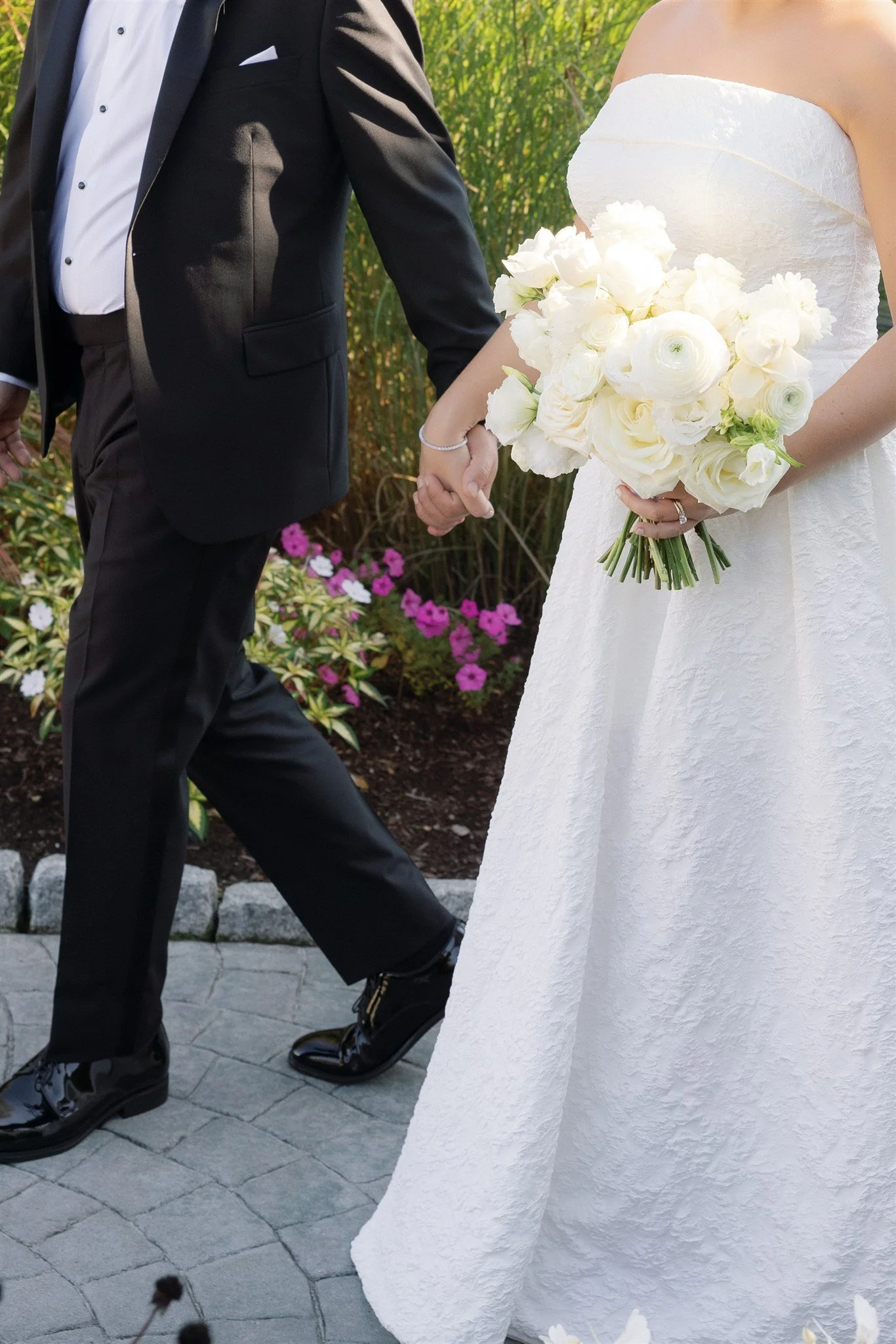 A sculptural all-white bouquet glowing in soft summer light.
