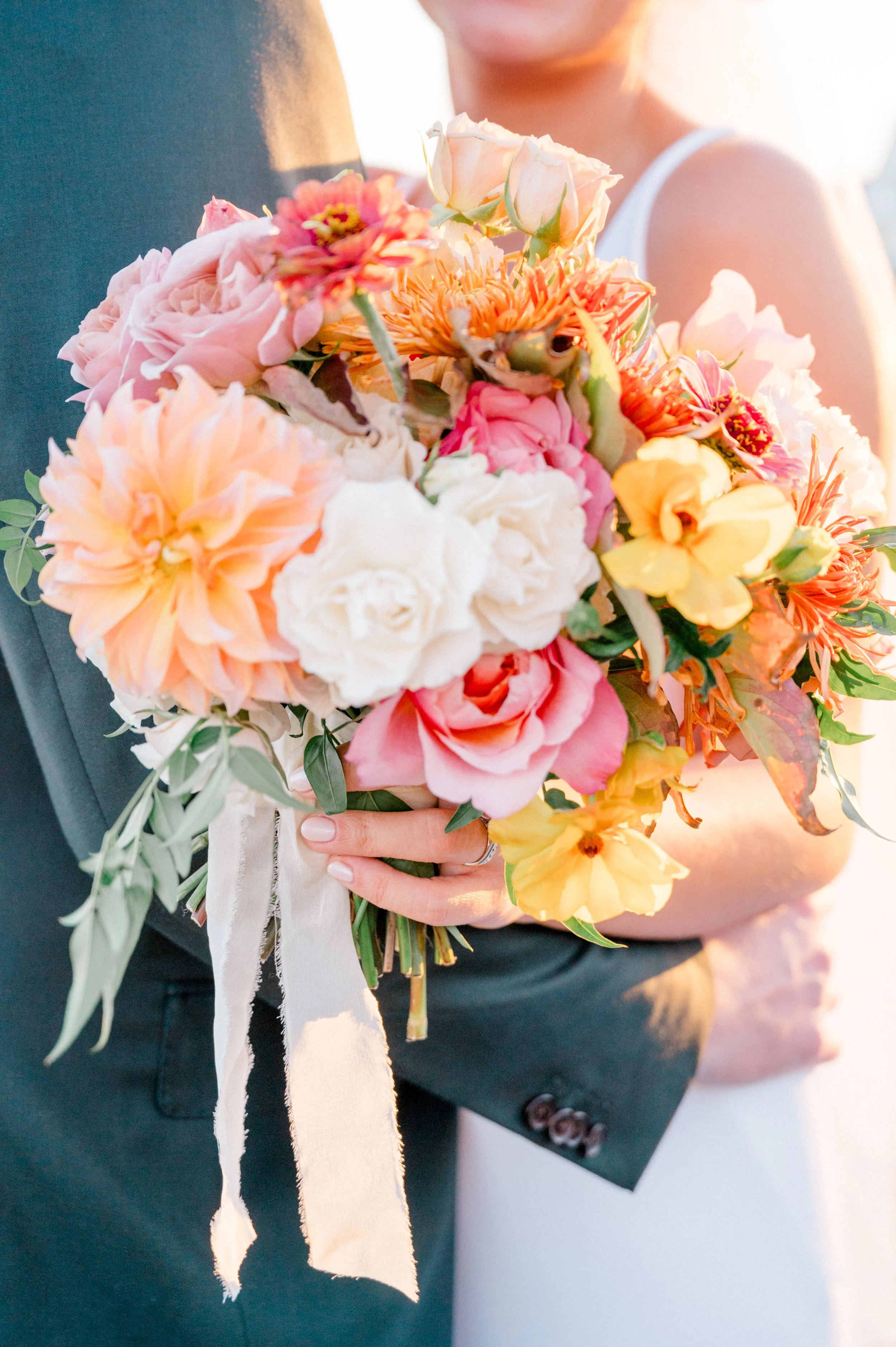 Film-style portrait highlighting textured fall bouquet against the backdrop of Long Island Sound.