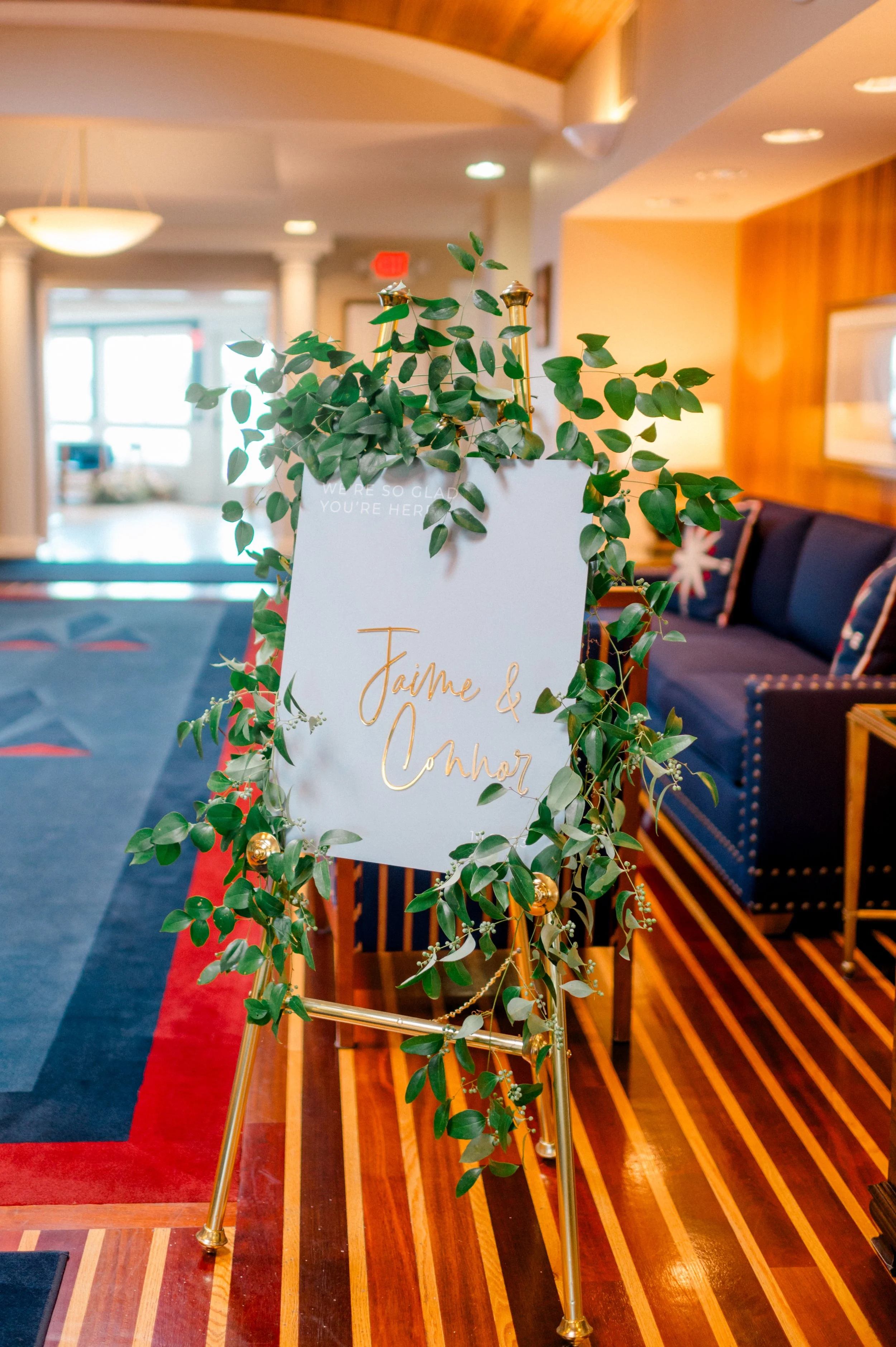Cascading smilax ceremony florals for coastal Connecticut wedding