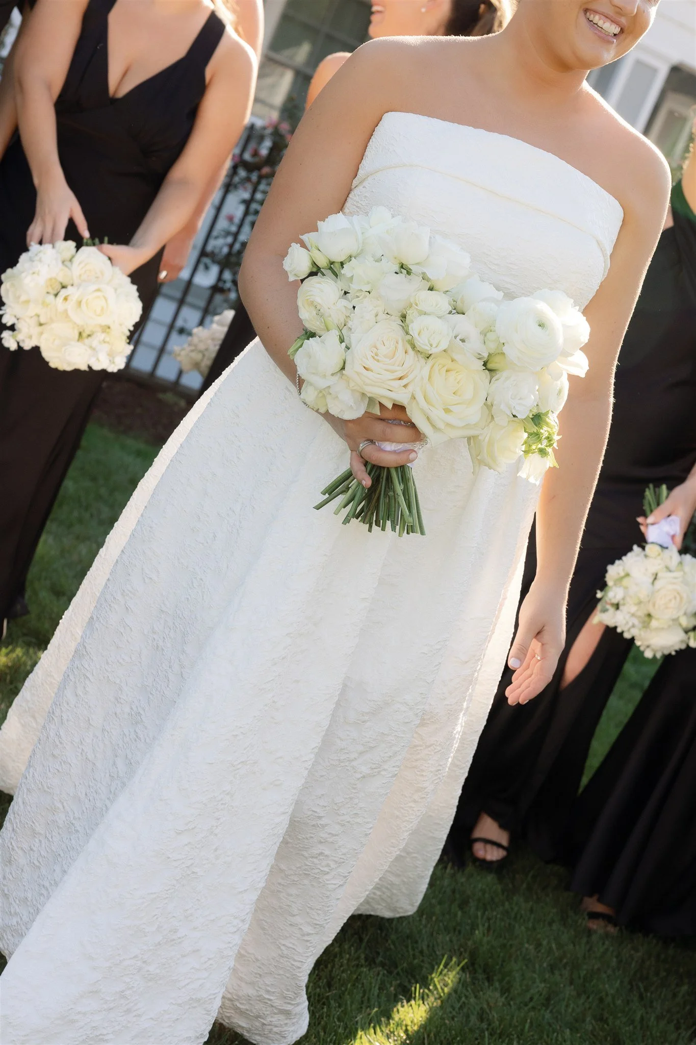 azy summer light casting soft glow over the ocean during a coastal Connecticut wedding.