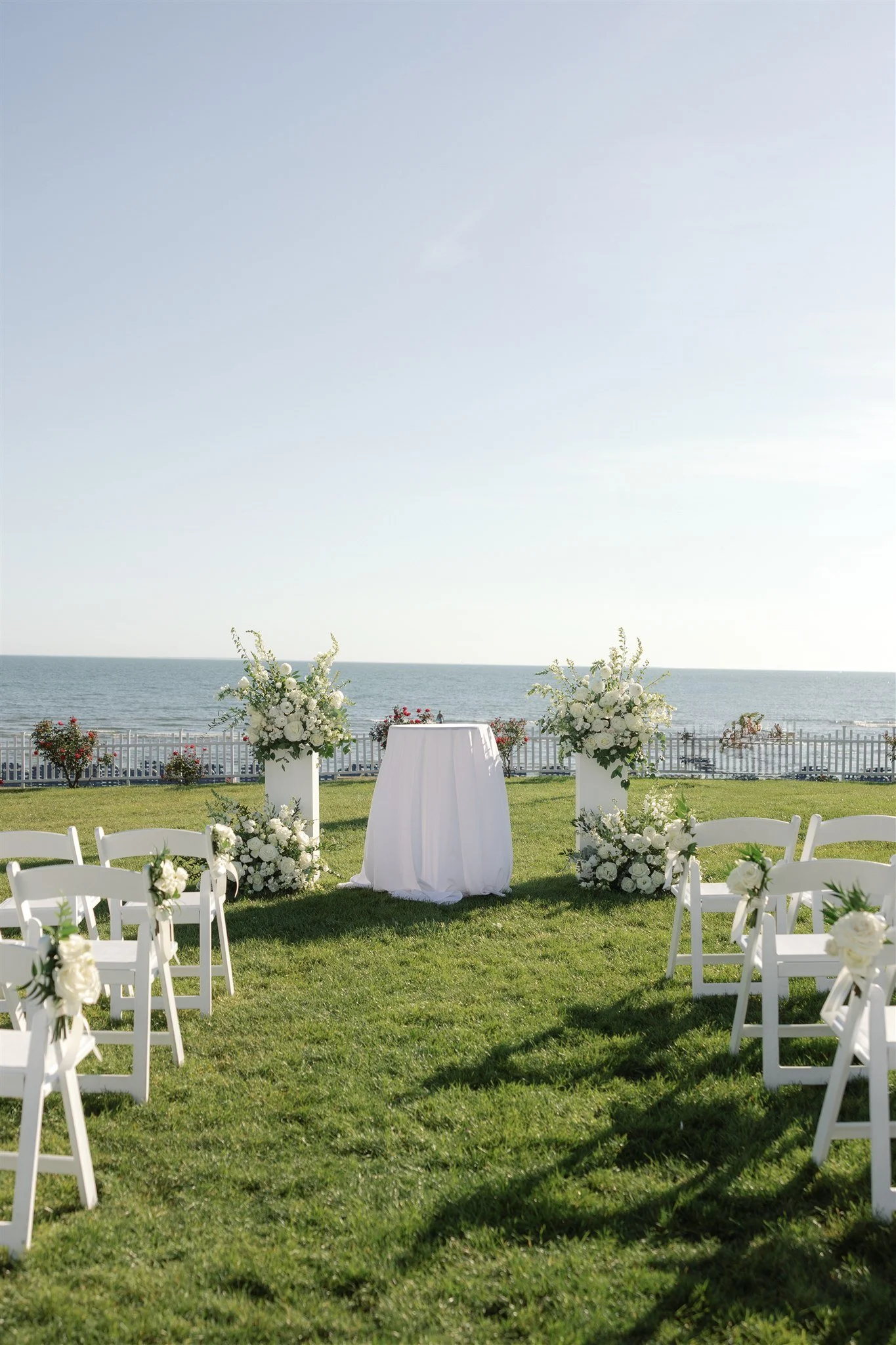 Detail of ceremony florals moving gently in the coastal breeze during a Connecticut summer wedding.