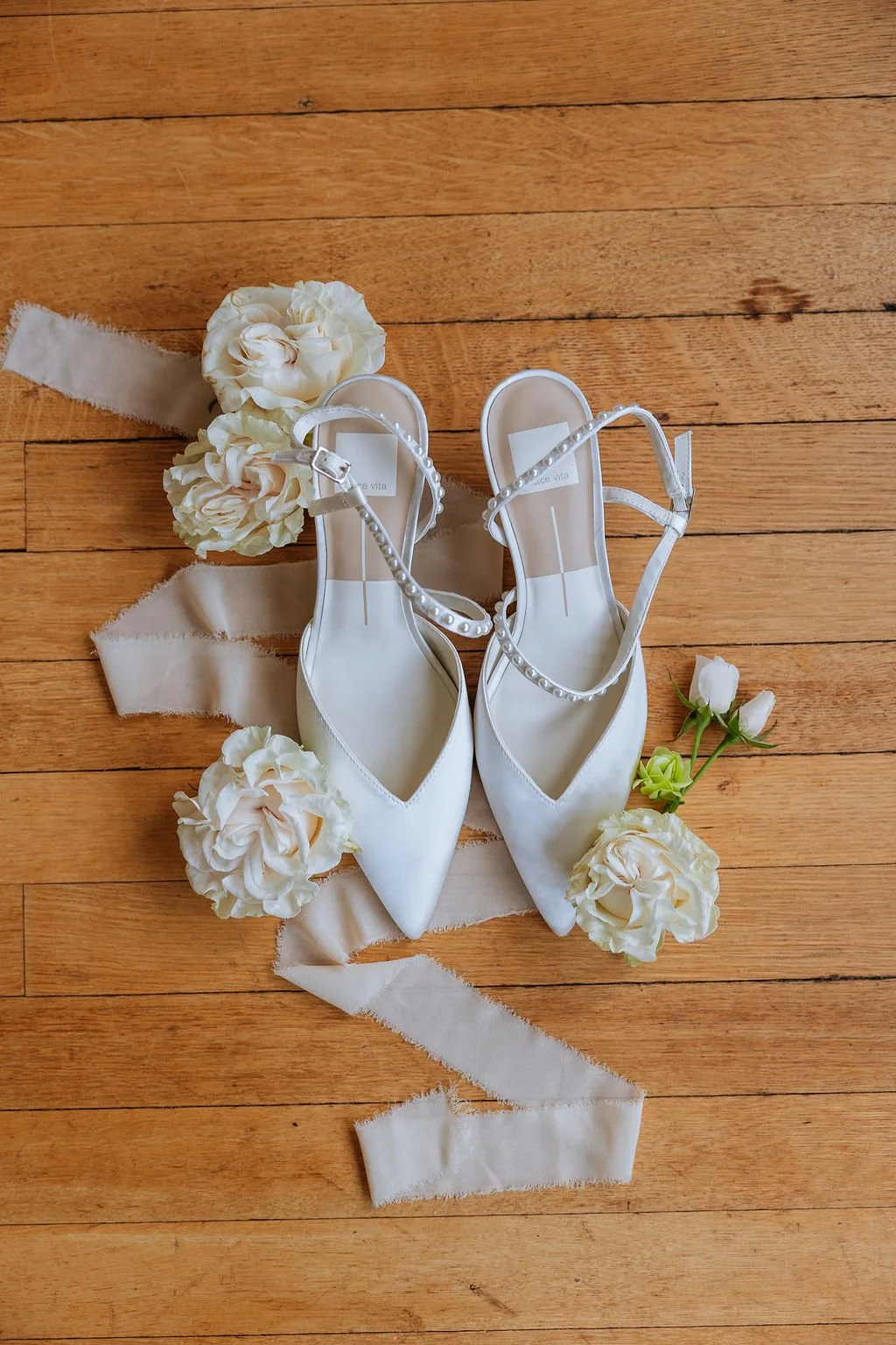 White garden-style wedding flowers and shoes by First Blush, Connecticut wedding florist and event management