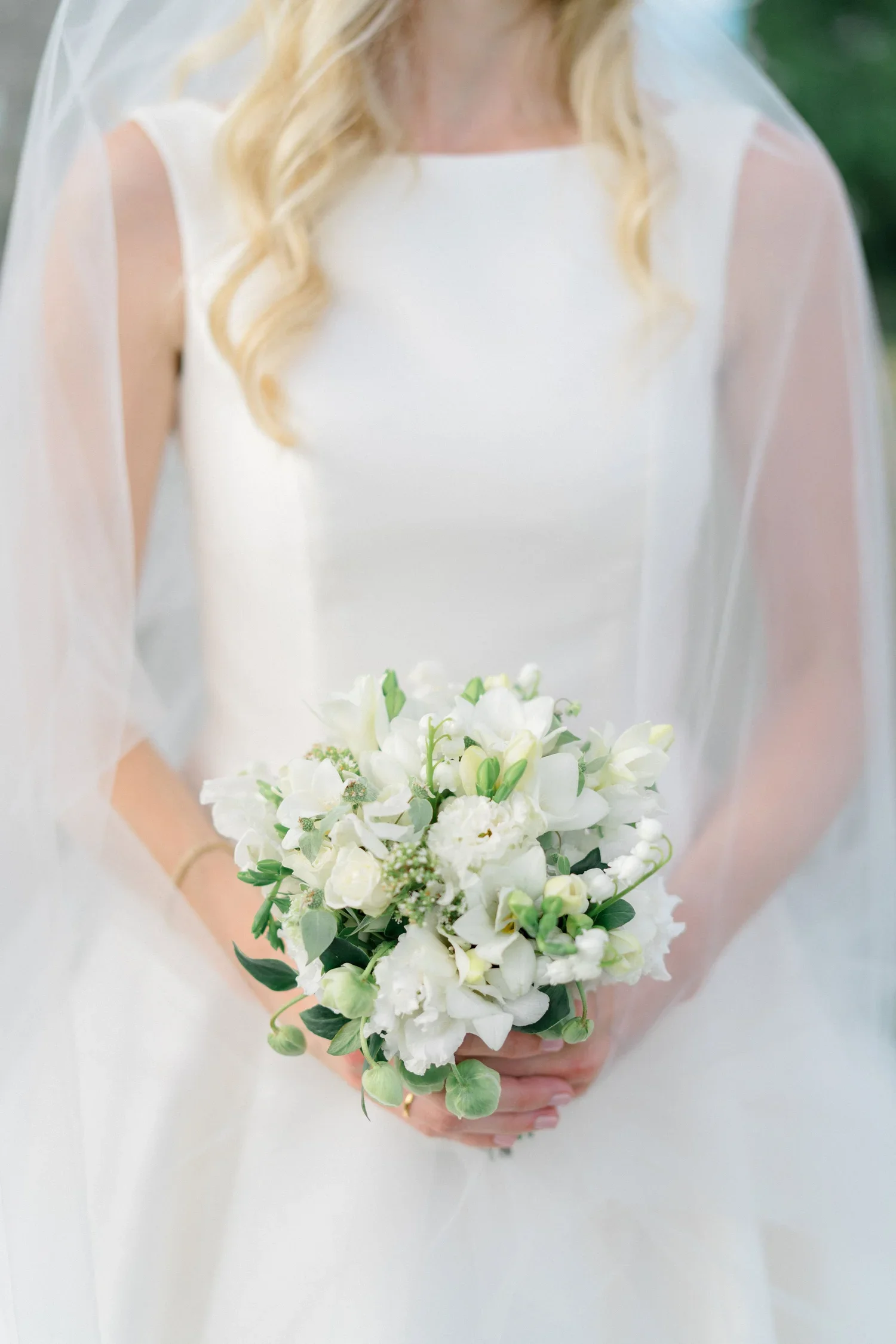 White spring bridal bouquet with hellebore and sweet pea for a Branford House wedding