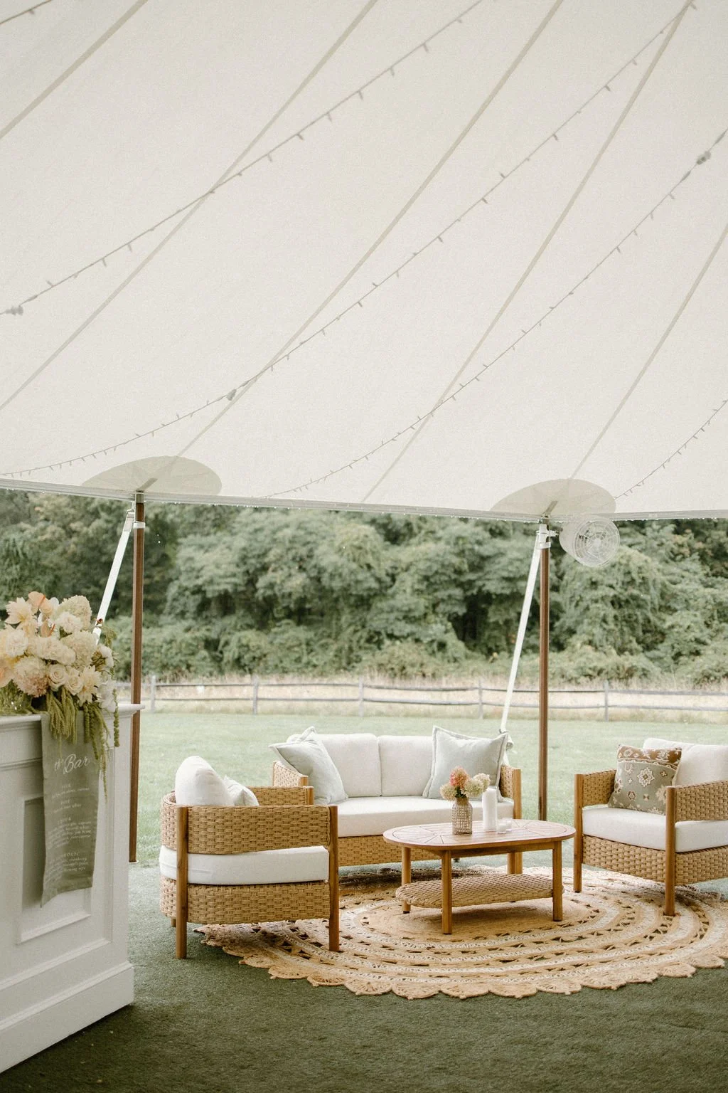 Outdoor sailcloth wedding reception tent overlooking the gardens and surrounding countryside.