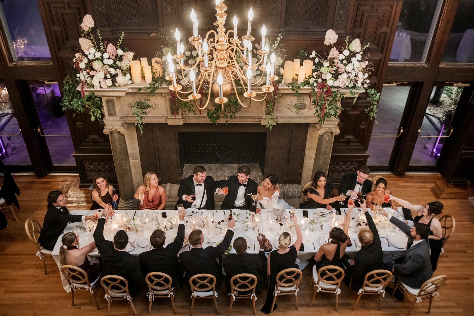 Elegant evening wedding reception at Branford House with candlelight and florals