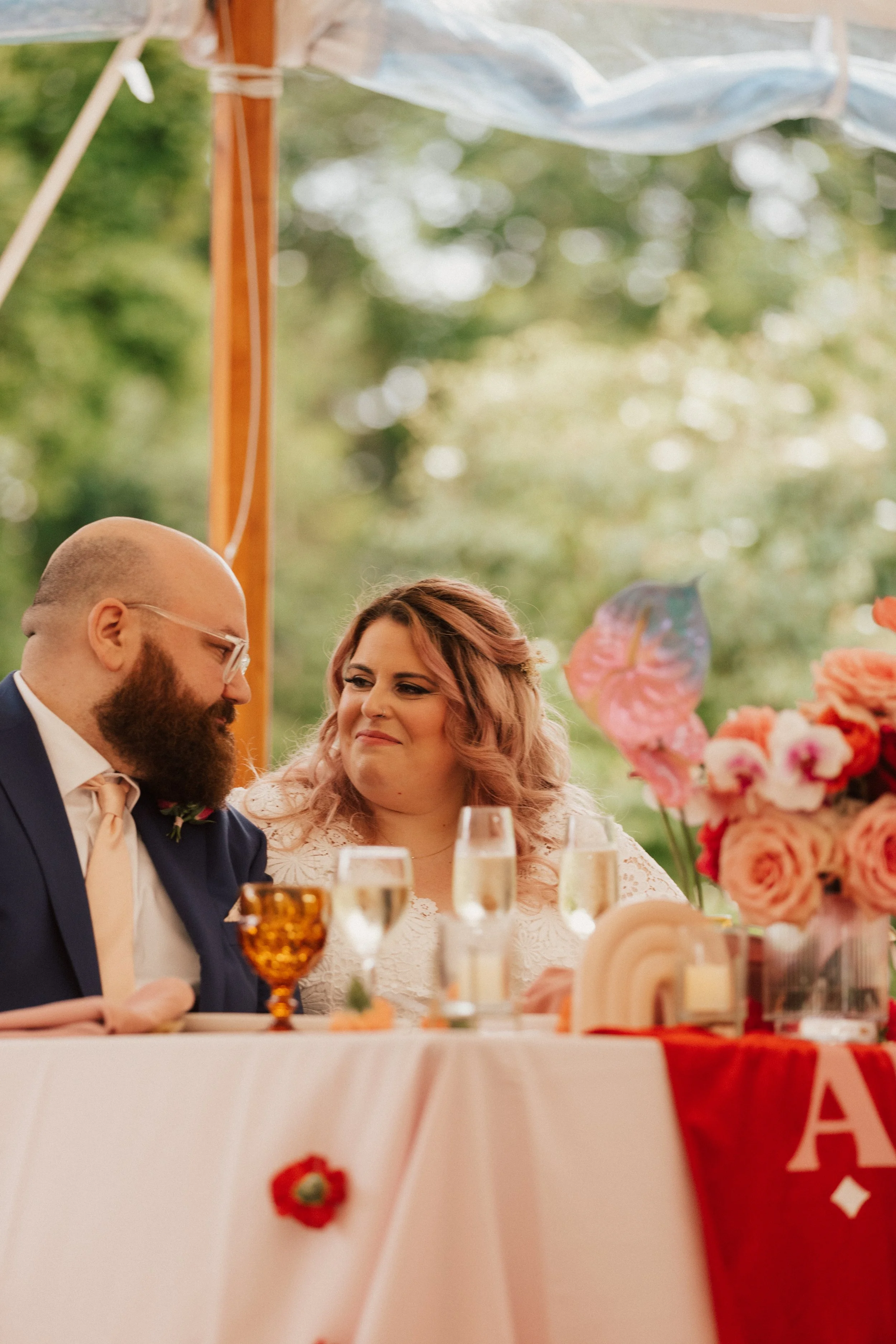 Wedding reception floral design by First Blush featuring sculptural arrangements and saturated color.