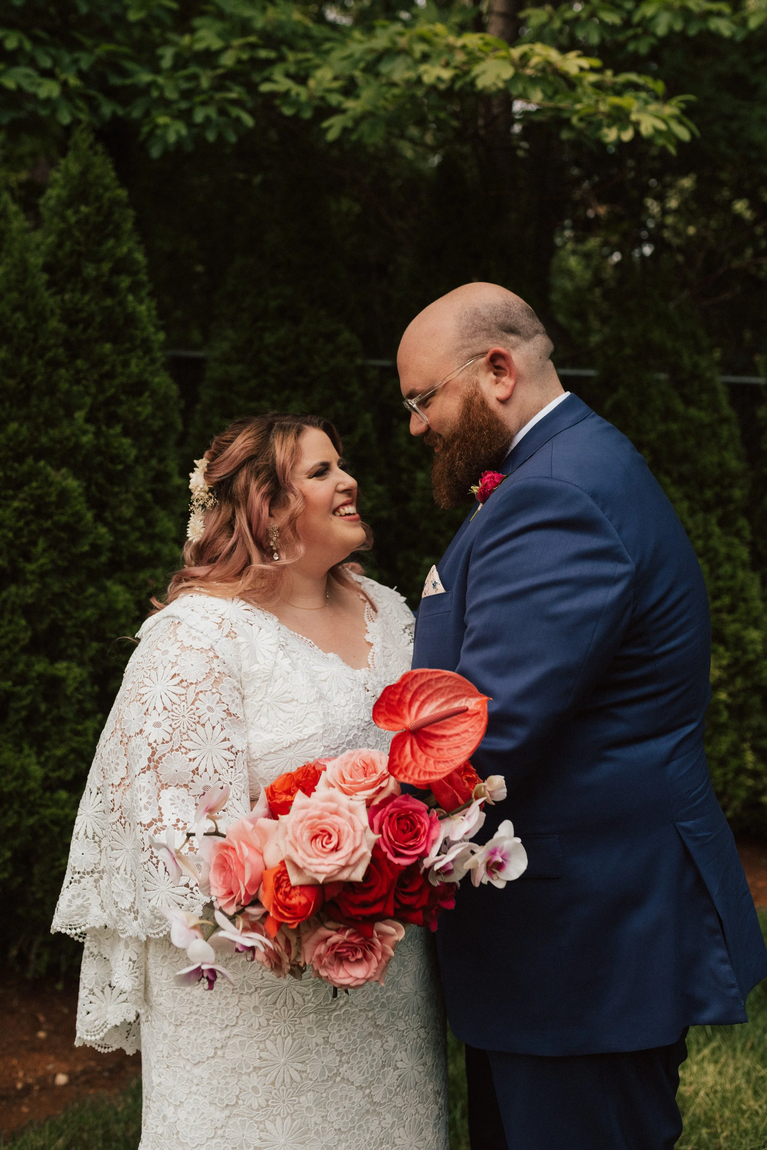 Bold, color-forward wedding design at The Garden at The Hops in Derby, Connecticut, featuring sculptural florals and a high-energy garden celebration.