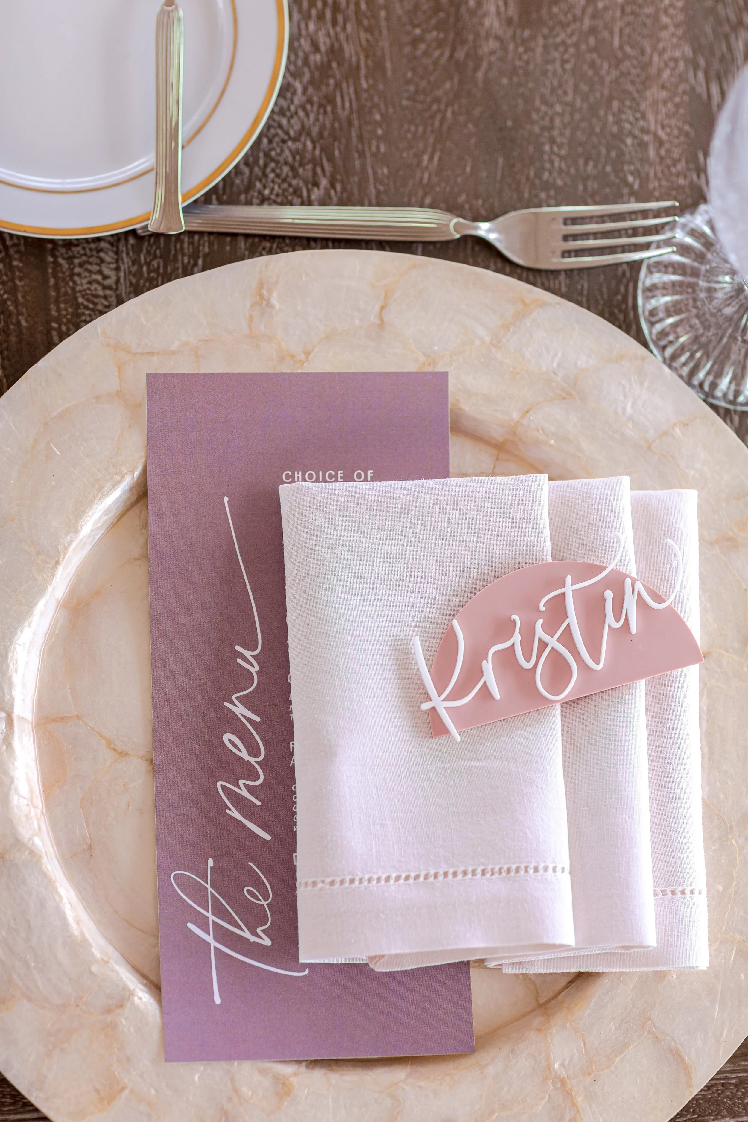Luxury baby shower place setting with soft lavender palette and refined tableware