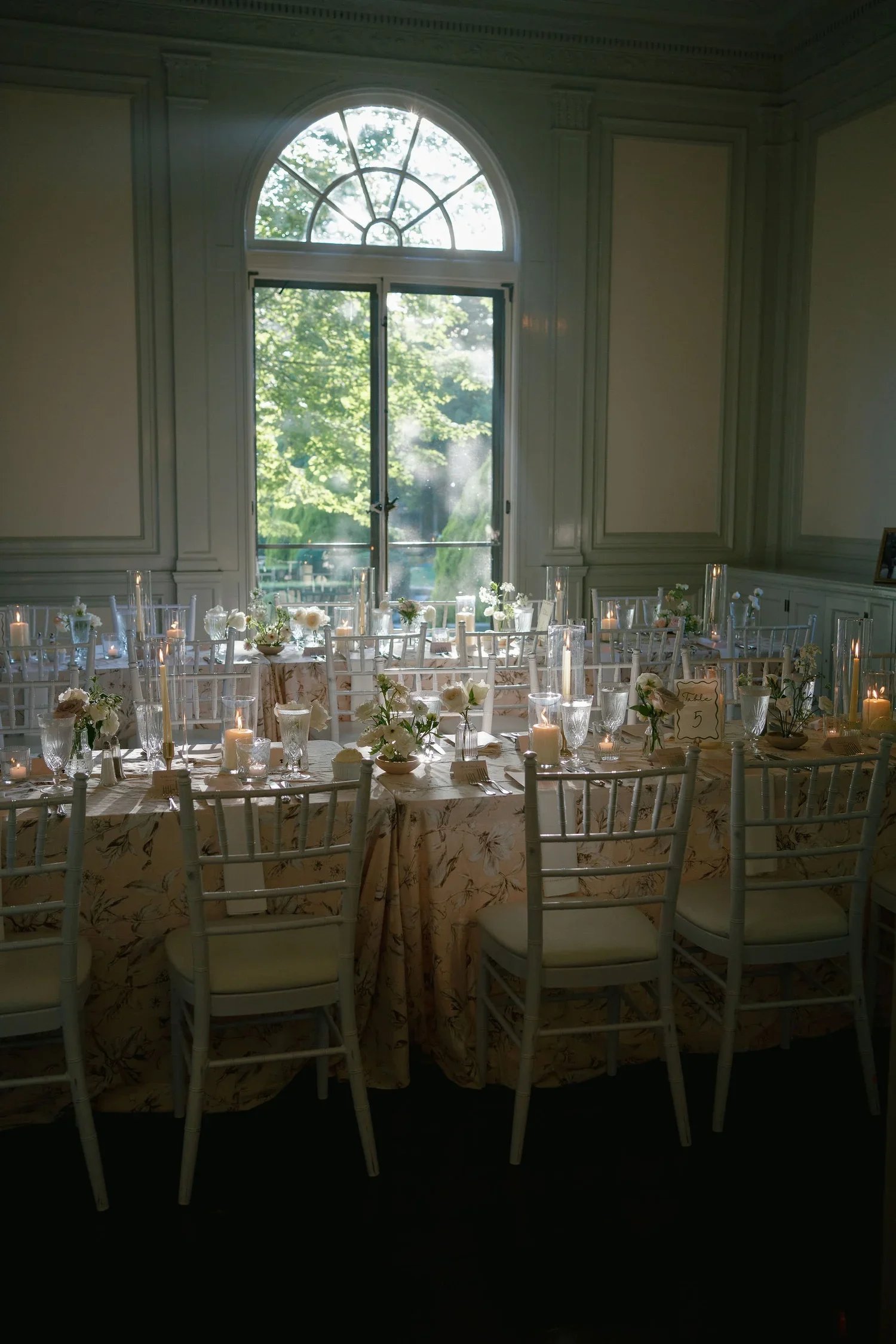 Delicate bud vase floral groupings styled for an intimate garden wedding reception at Eolia Mansion