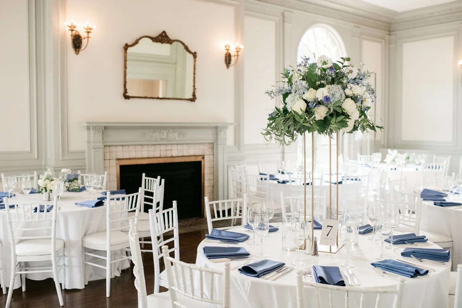 Blue and white wedding flowers featuring delphinium and hydrangea for a coastal Eolia Mansion celebration.