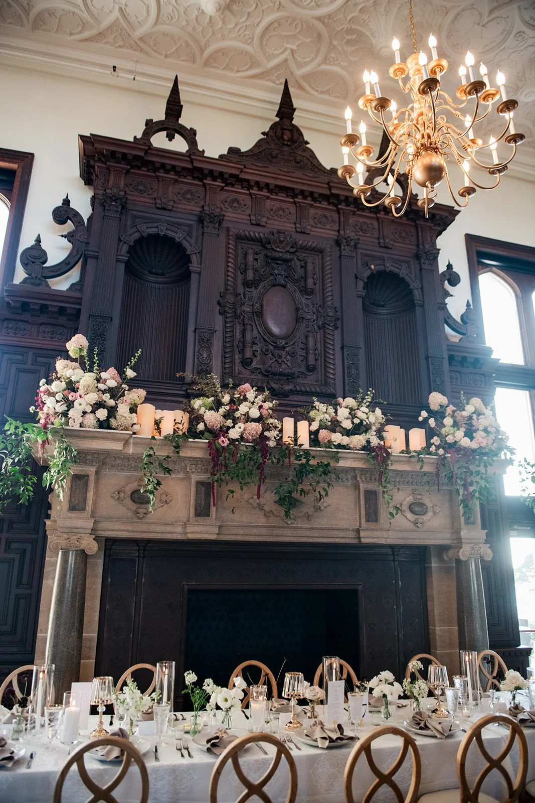 Reception atmosphere at Branford House with candlelight, florals, and long-table dining.