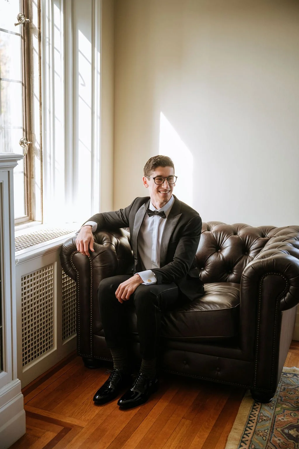 Classic groom portrait in tuxedos surrounded by fall foliage