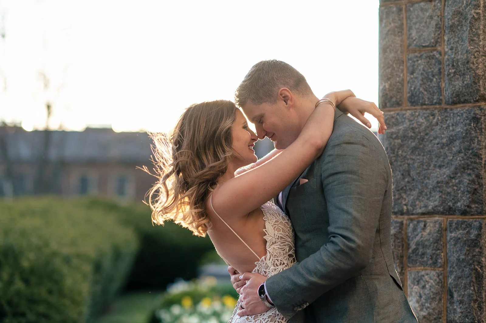 Golden-hour wedding portrait of the bride and groom along the Connecticut shoreline at Branford House