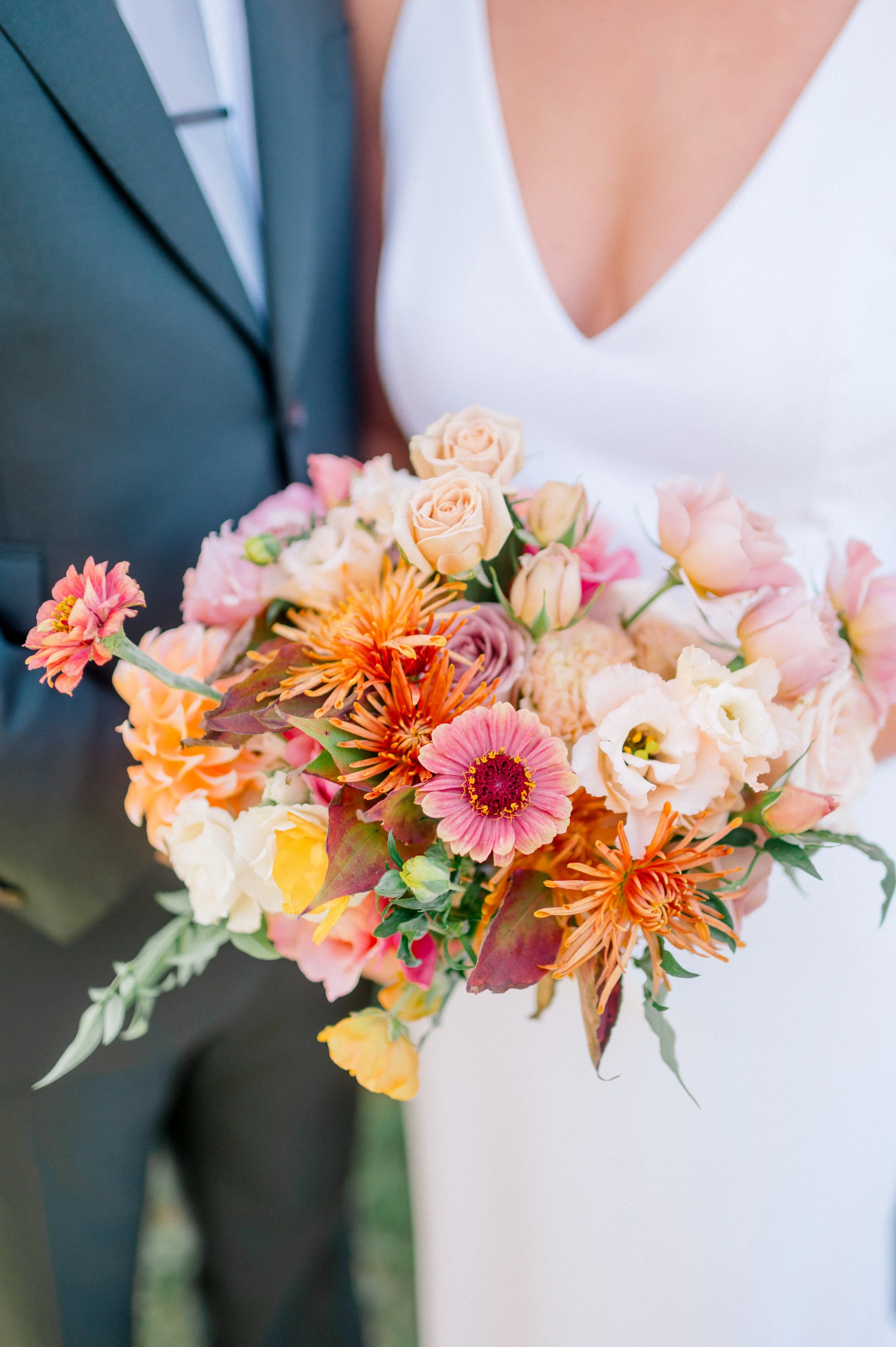 Statement bouquet featuring bold fall colors and textured foliage.
