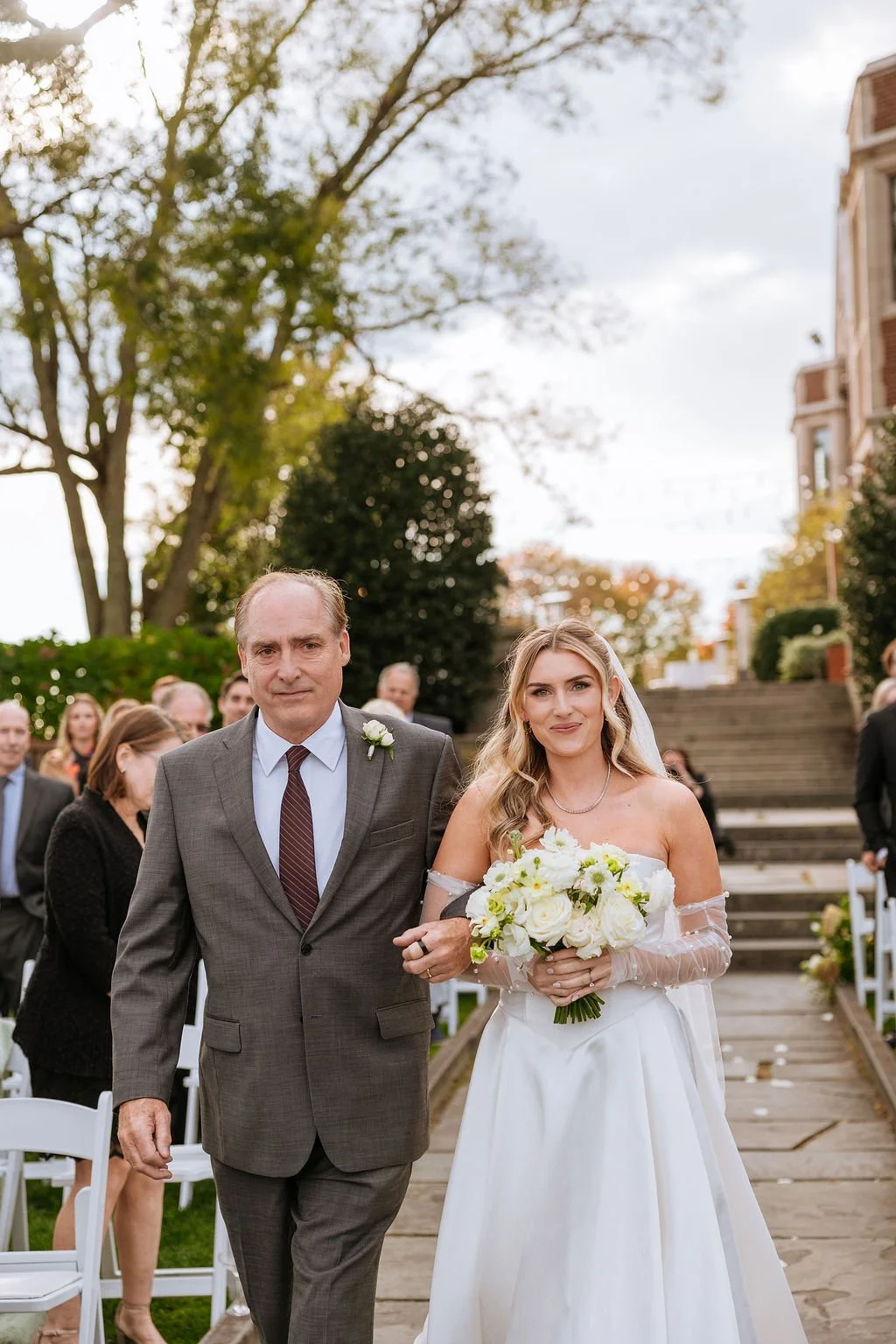 Romantic neutral bridal bouquet with layered ranunculus and roses at Connecticut estate wedding