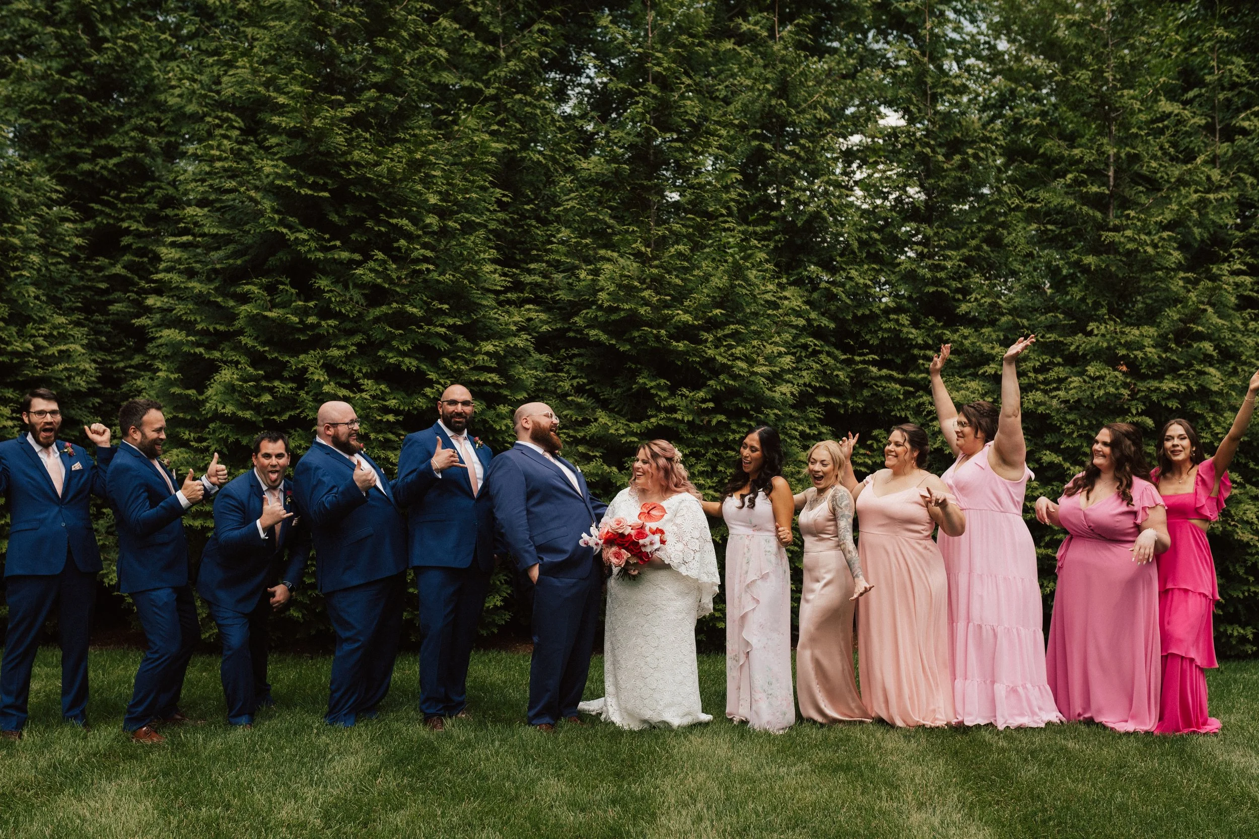 Editorial-style wedding bouquet with bold florals, cascading orchids, and modern garden textures.