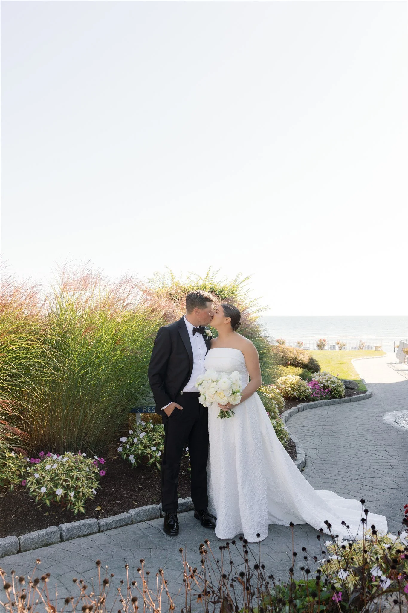 Soft, textural bridal bouquet featuring Playa Blanca roses and white lisianthus for an elegant Connecticut wedding.
