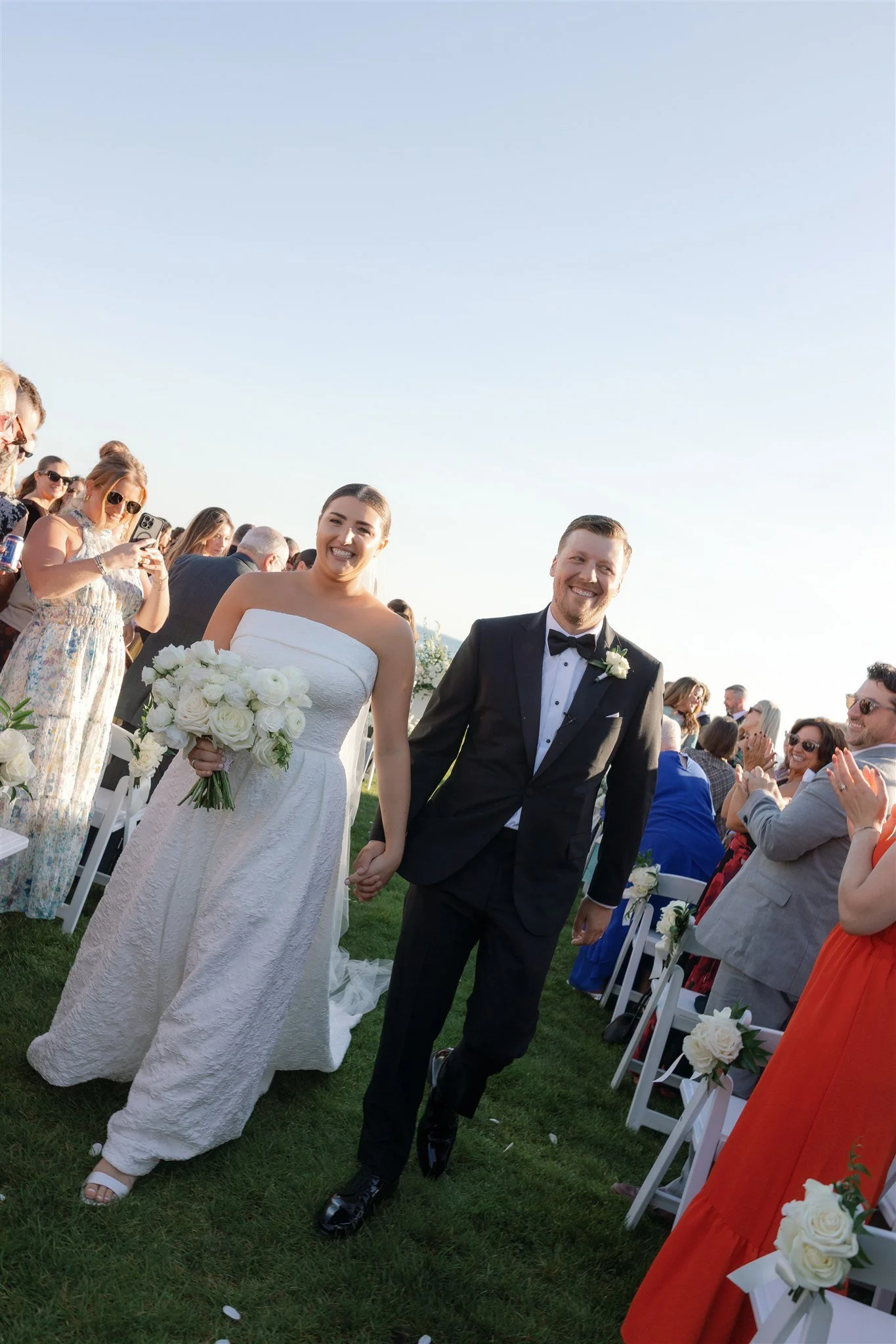 Editorial-style portrait of the couple in classic wedding attire at Water’s Edge Resort.
